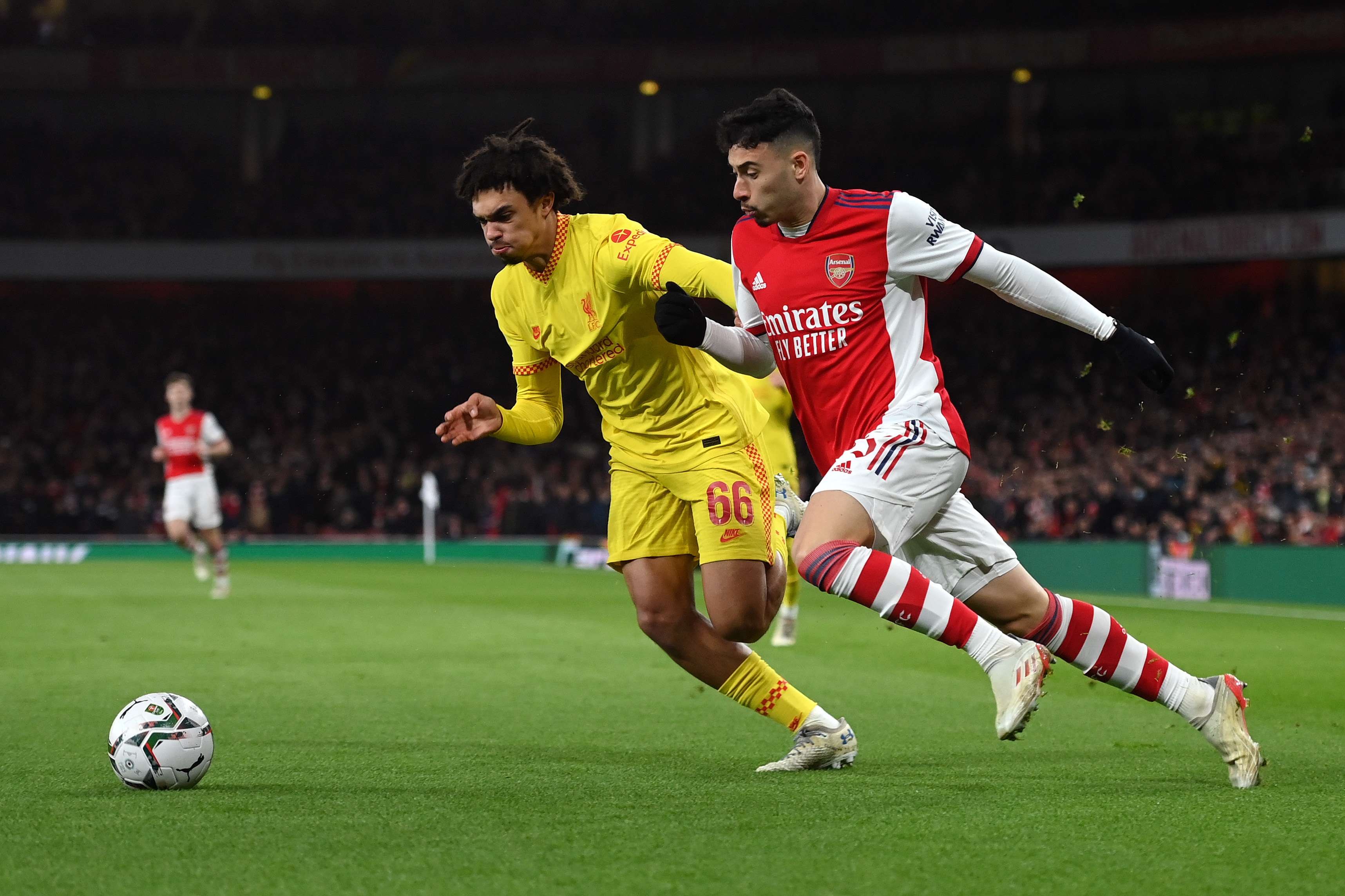 Gabriel Martinelli of Arsenal battles with Trent Alexander-Arnold of Liverpool
