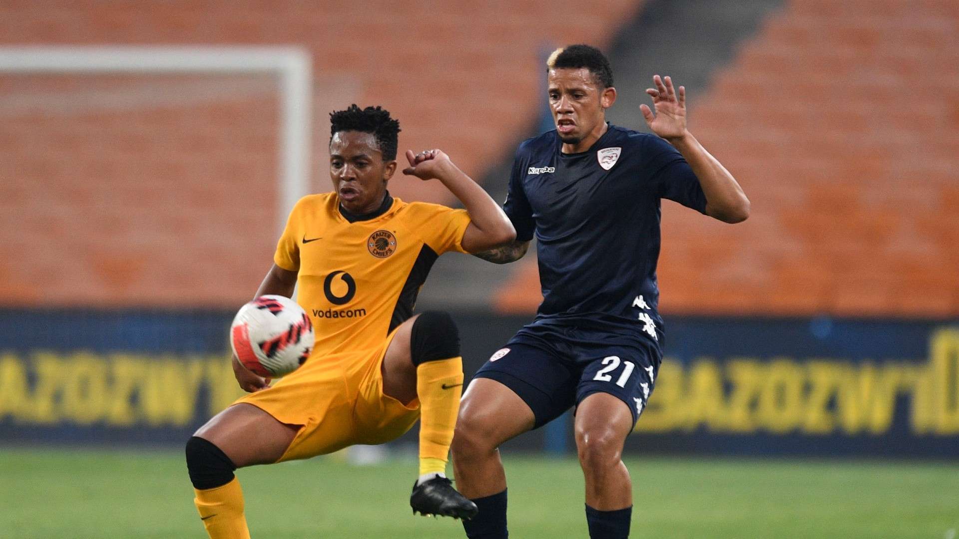 Cheslyn Jampies of Sekhukhune United FC challenges Nkosingiphile Ngcobo of Kaizer Chiefs, December 2021