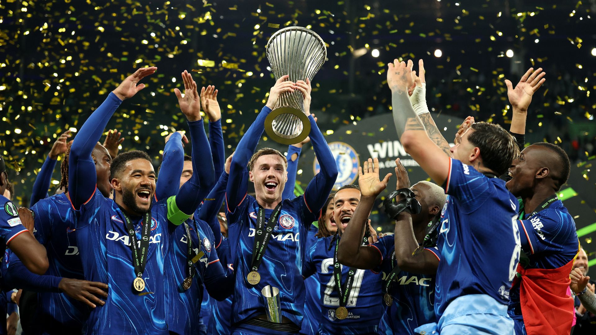 Cole Palmer of Chelsea lifts the UEFA Conference League trophy