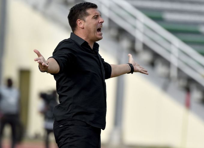 Juan Cruz Real gritando en un partido de América de Cali