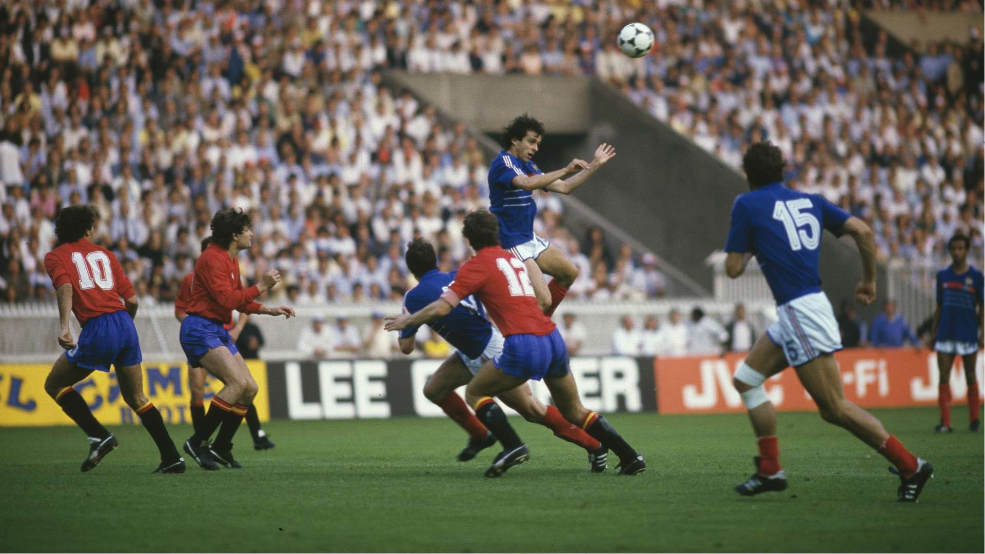 Michel Platini heading the ball against Spain in the 1984 Euro final