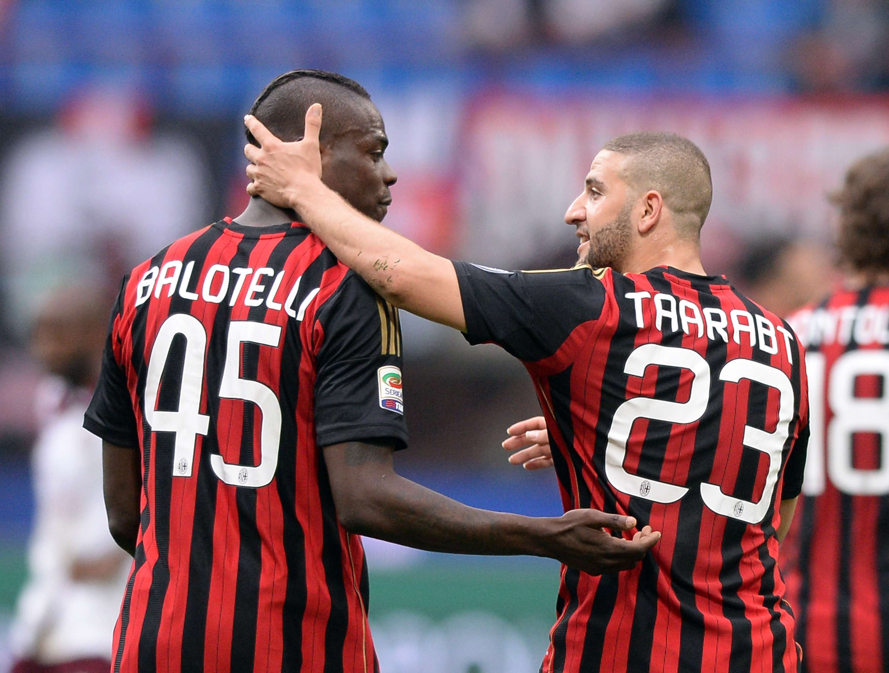 Milan's Mario Balotelli and Adel Taarabt celebrate