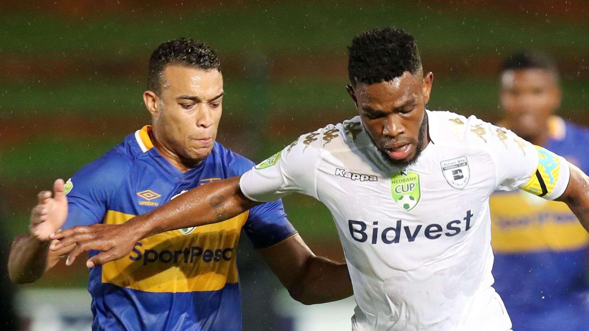 Thulani Hlatshwayo of Bidvest Wits challenged by Matthew Rusike of Cape Town City