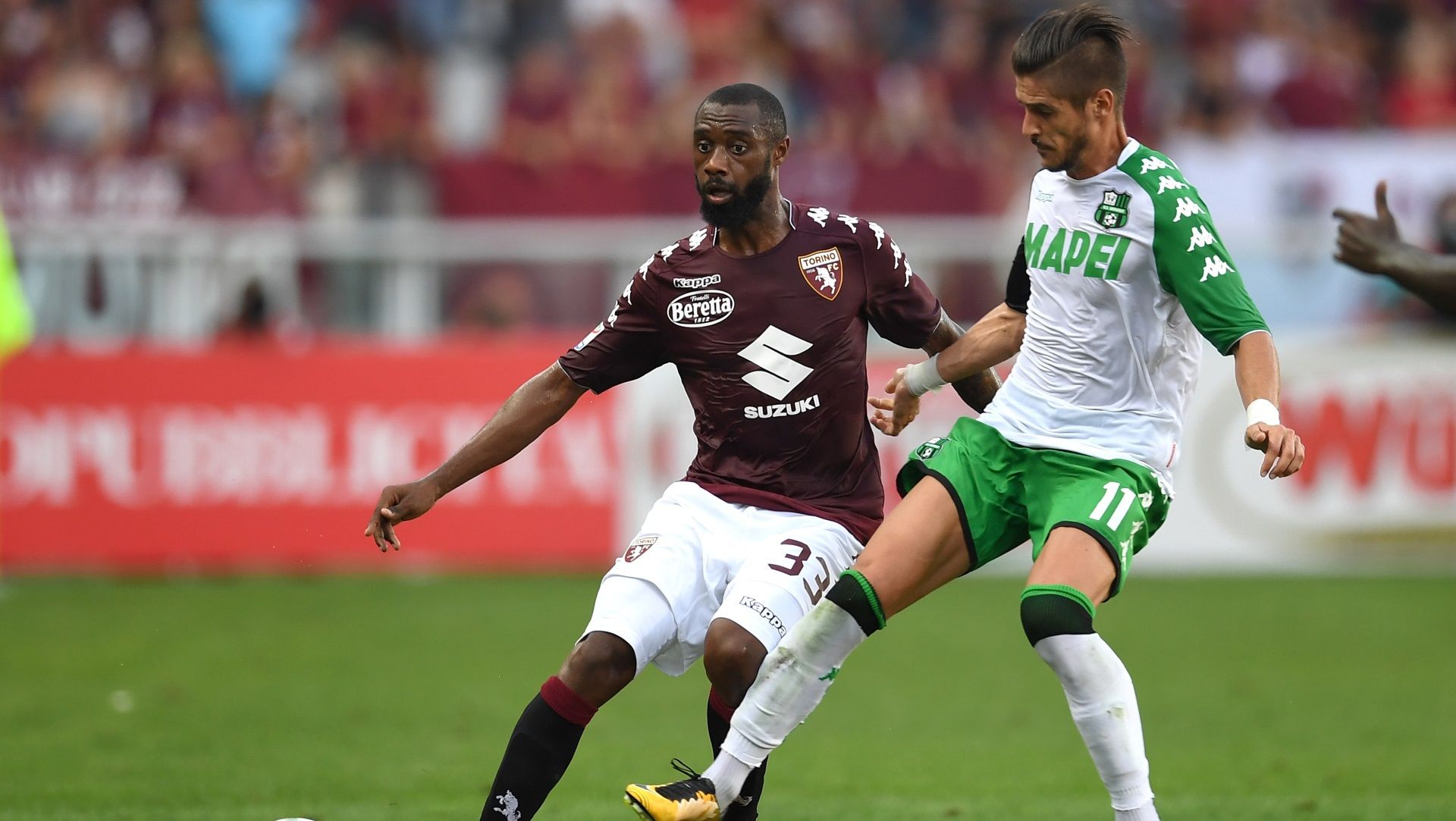 Nicolas Nkoulou of Torino, Sassuolo's Diego Falcinelli