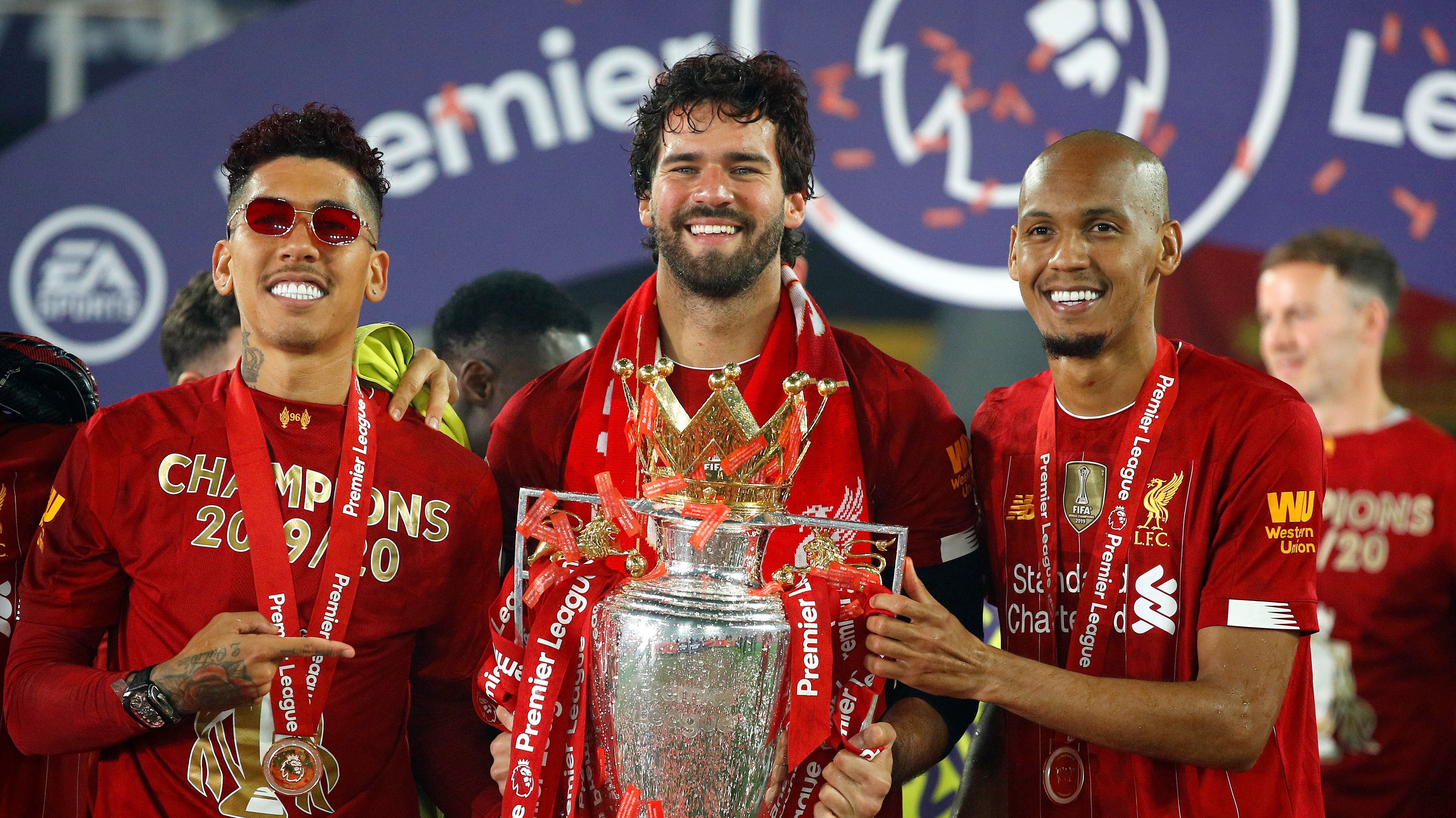 Liverpool lifts The Premier League trophy following the Premier League match between Liverpool FC and Chelsea FC at Anfield on July 22, 2020