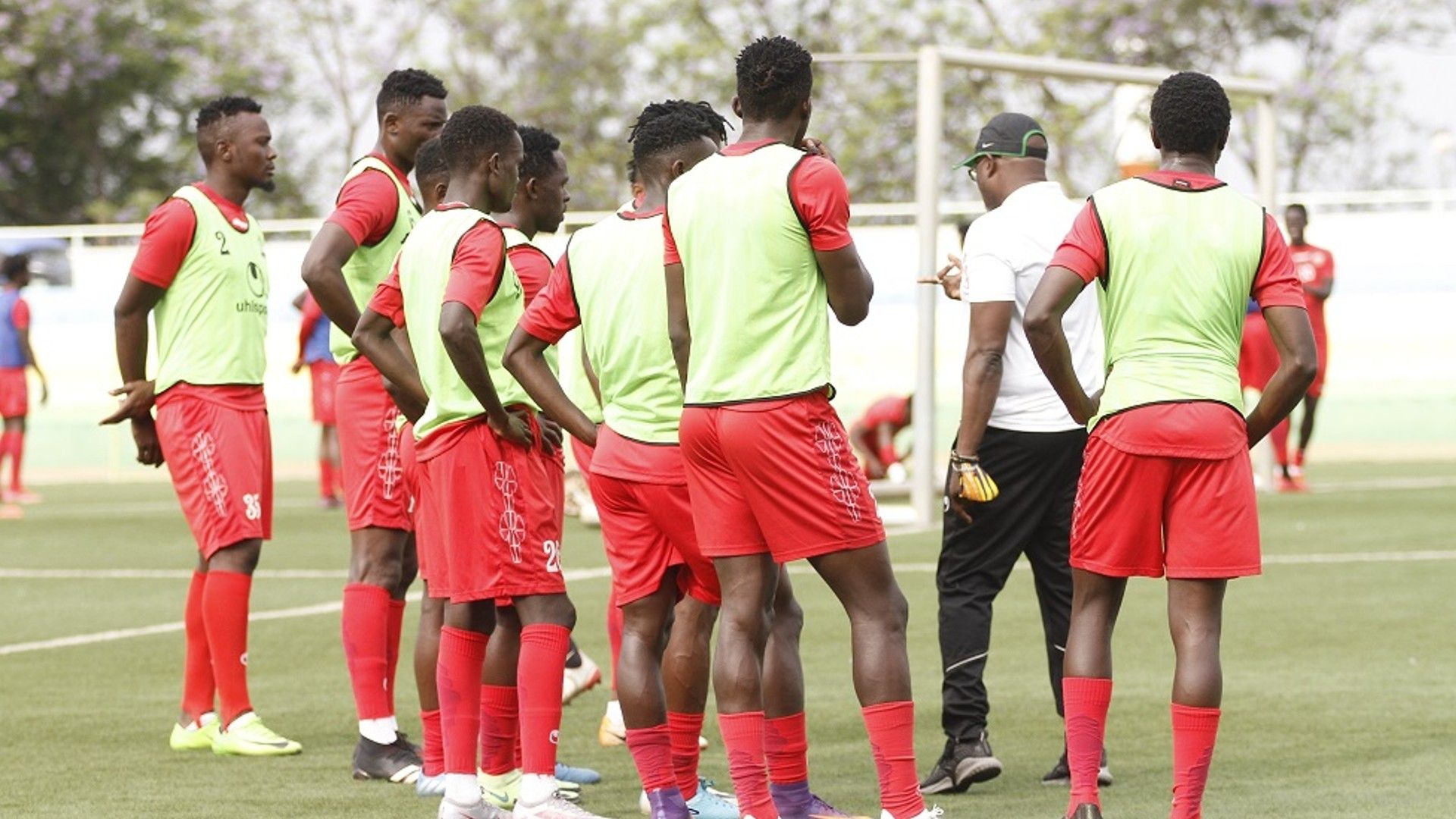 Harambee Stars players and coach Jacob Mulee.