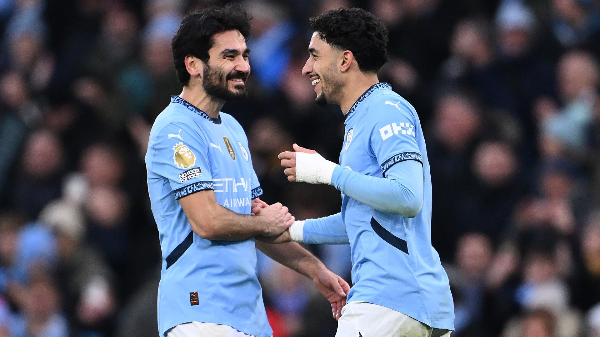 Omar Marmoush of Manchester City celebrates scoring his team's third goal and completing his hat-trick with teammate Ilkay Guendogan