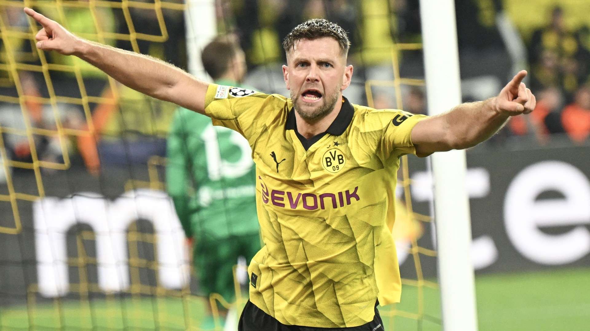 Dortmund's German forward #14 Niclas Fuellkrug celebrates scoring