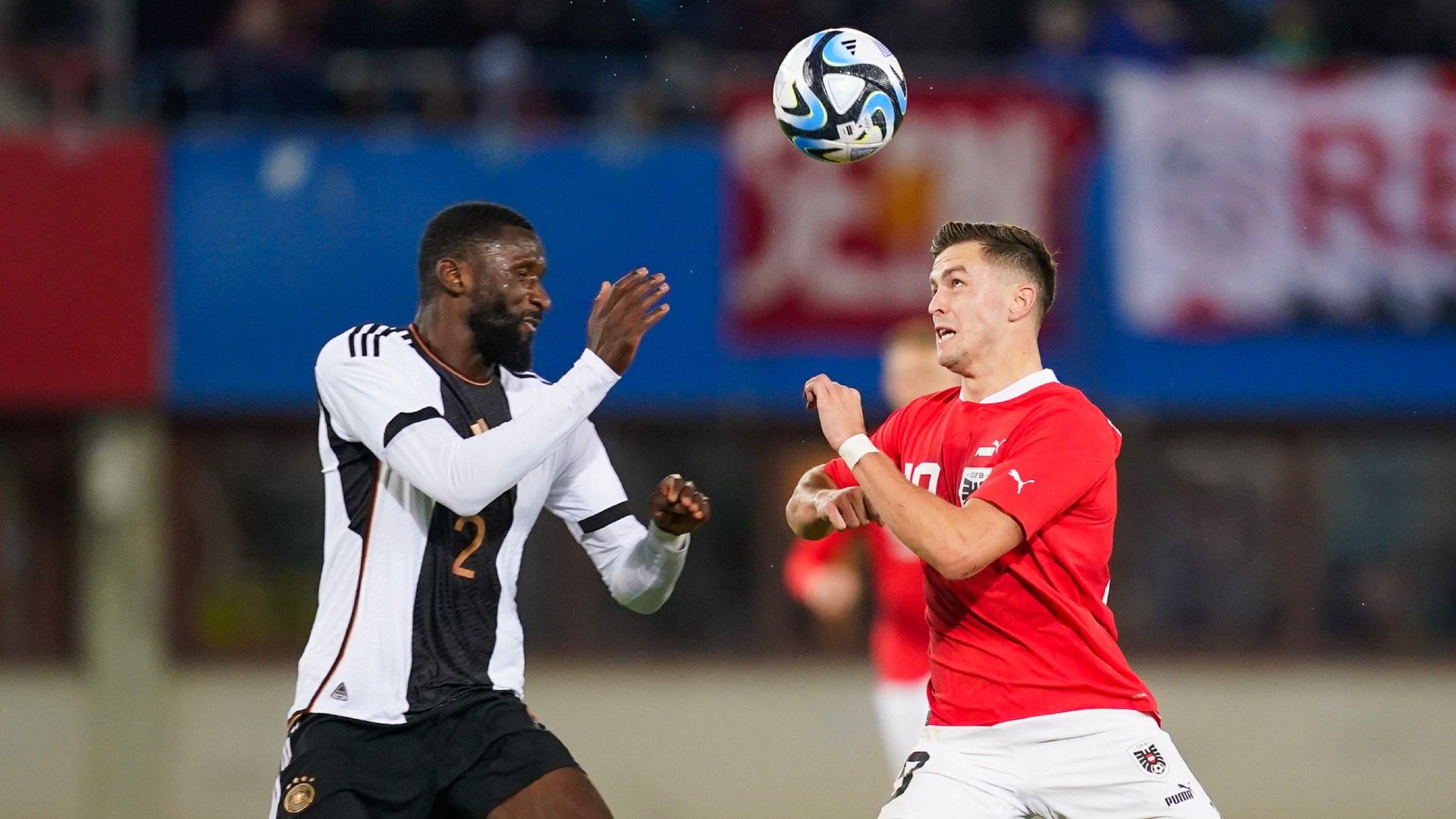 Antonio Ruediger of Germany battles for possession with Christoph Baumgartner of Austria