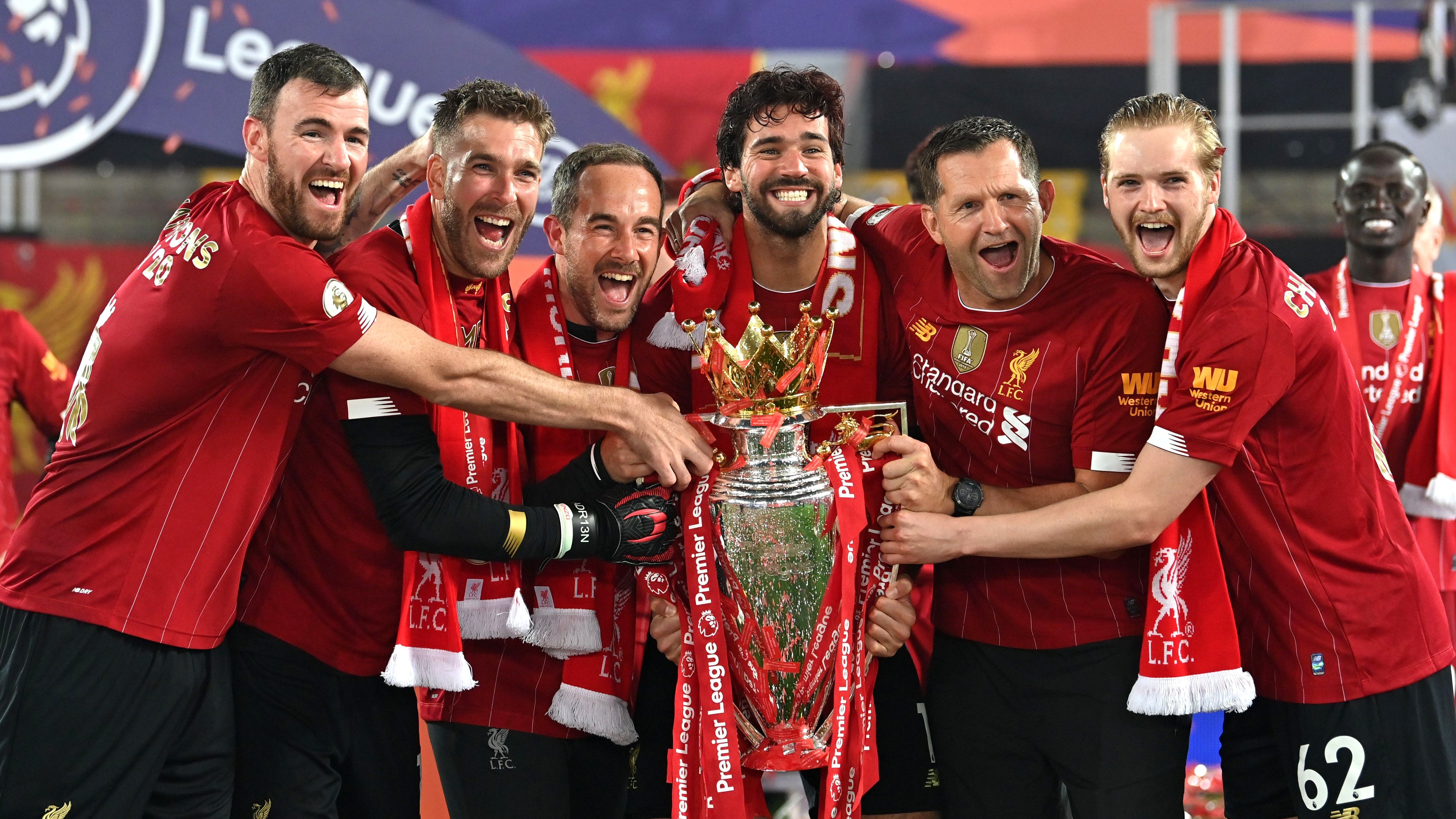Liverpool lifts The Premier League trophy following the Premier League match between Liverpool FC and Chelsea FC at Anfield on July 22, 2020