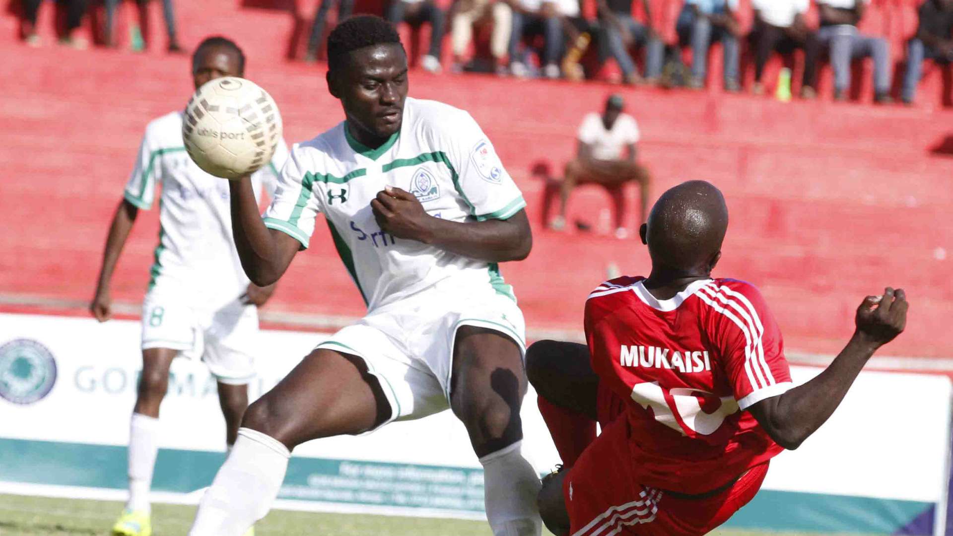 Dennis Mukaisi tackle Musa Mohammed.