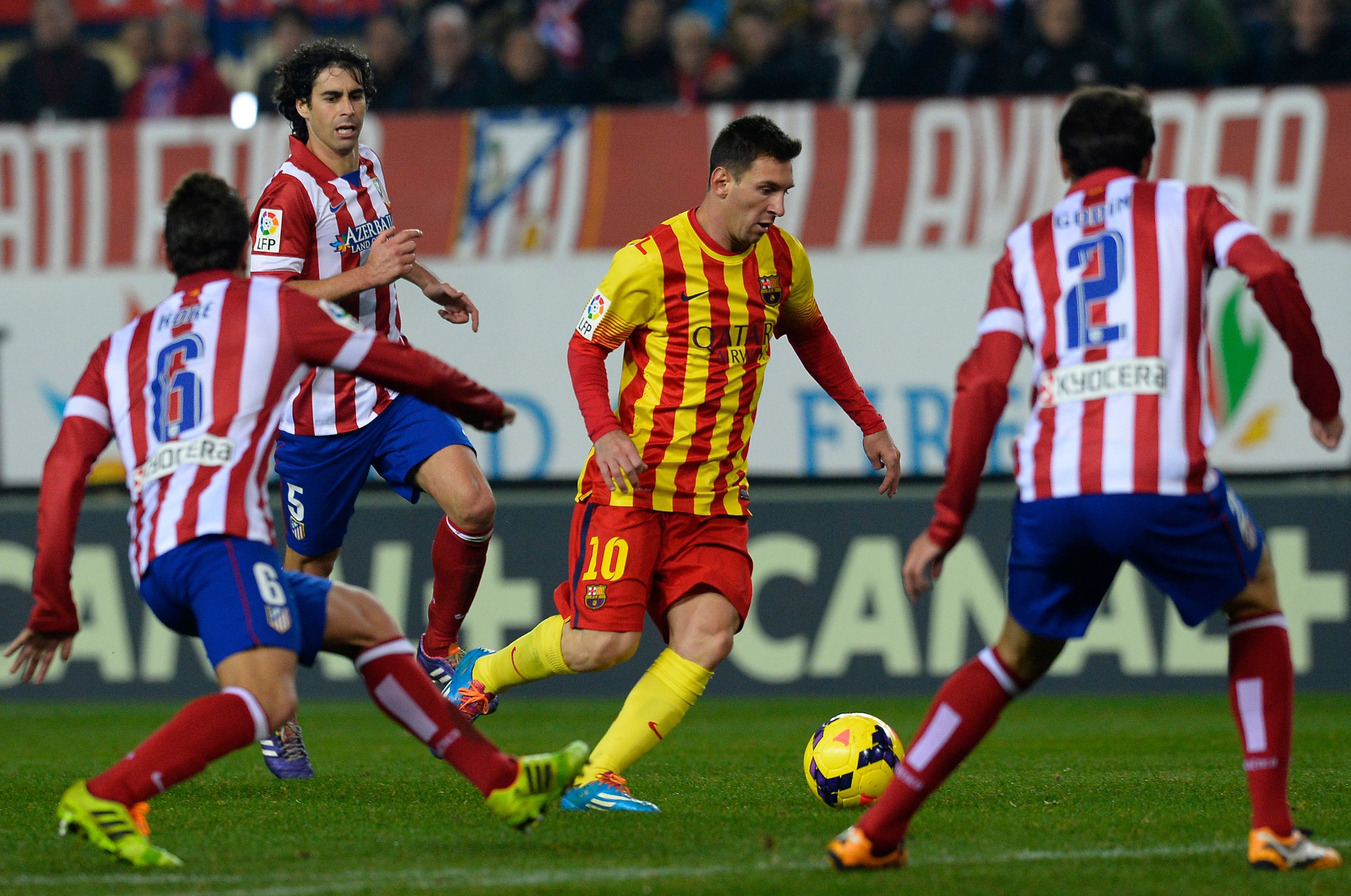 Atletico Madrid and Barcelona players battle