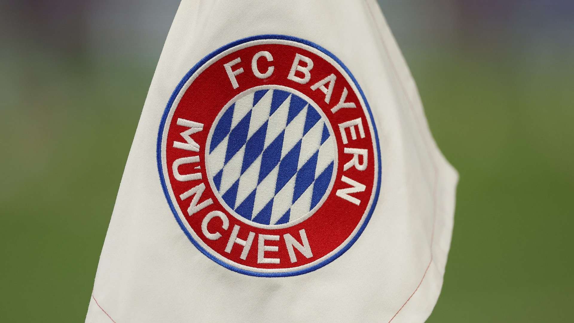 A photo shows a Bayern Munich logo on a pitch flag