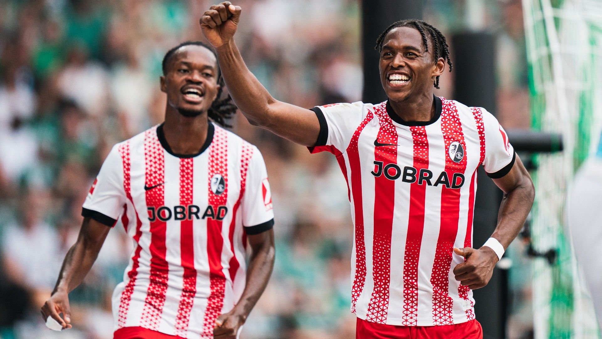 Junior Adamu of SC Freiburg celebrates after scoring