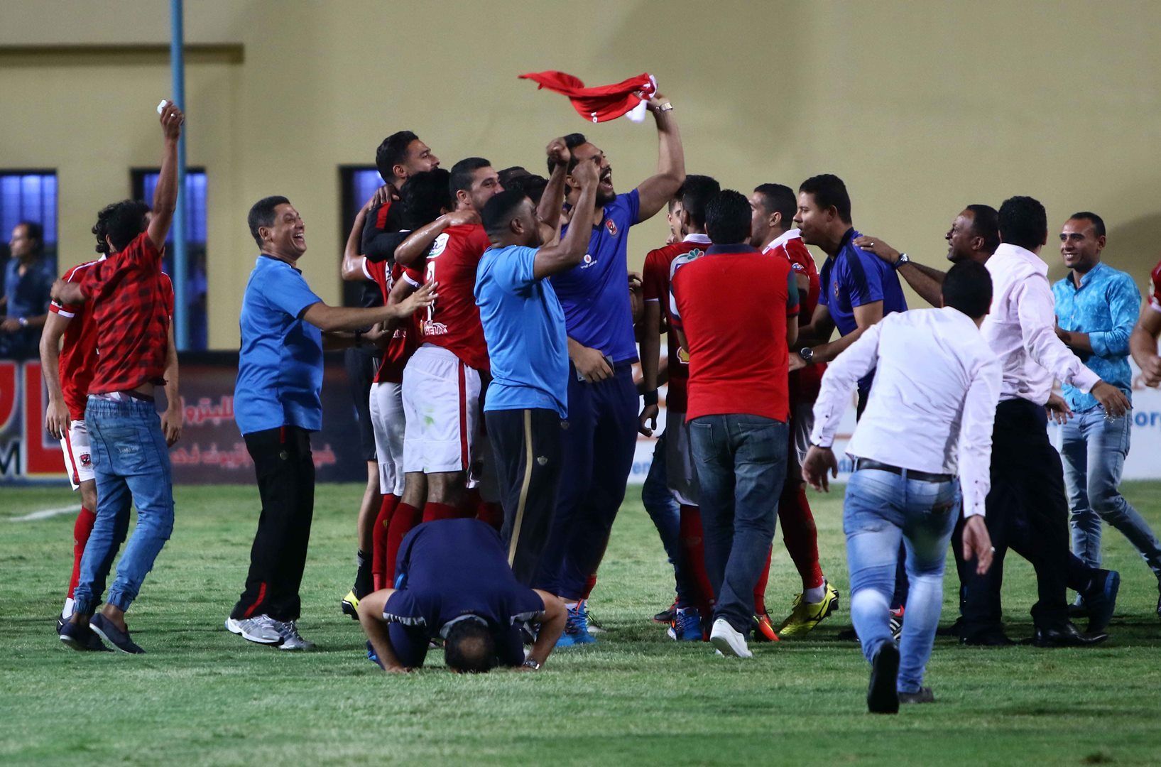 Al Ahly players celebrate winning the league title
