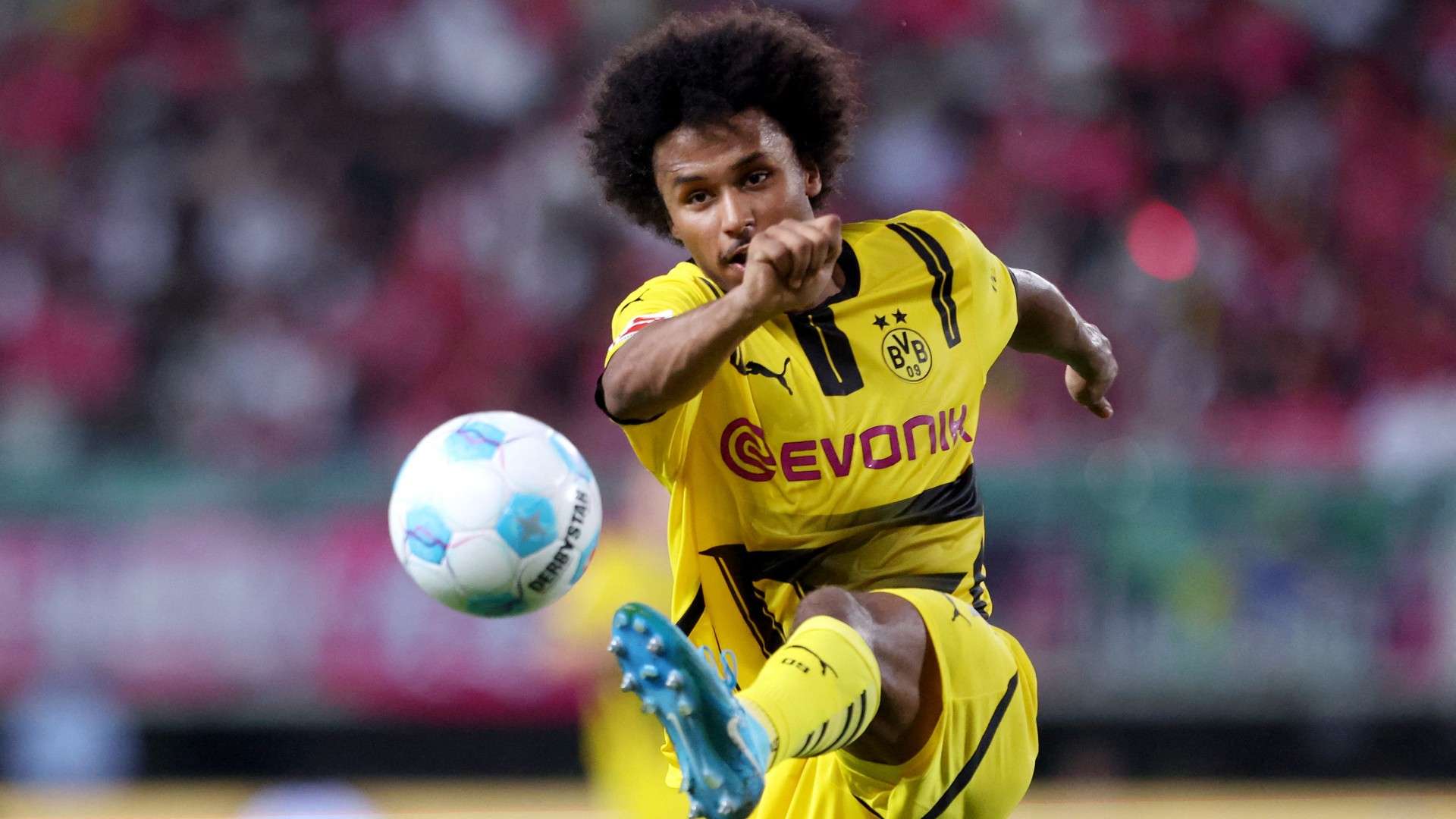 Borussia Dortmund's Karim Adeyemi kicks the ball