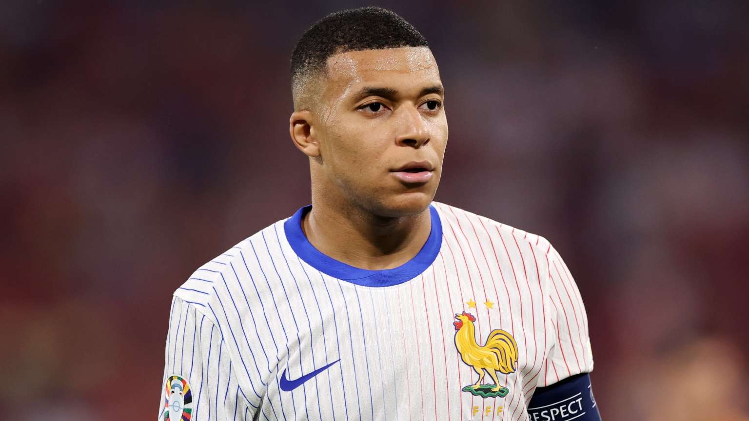 Kylian Mbappe of France looks on