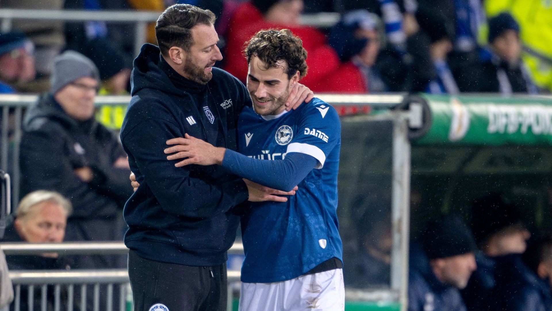 Head coach Michel Mitch Kniat (L) and Christopher Lannert of Bielefeld celebrate 