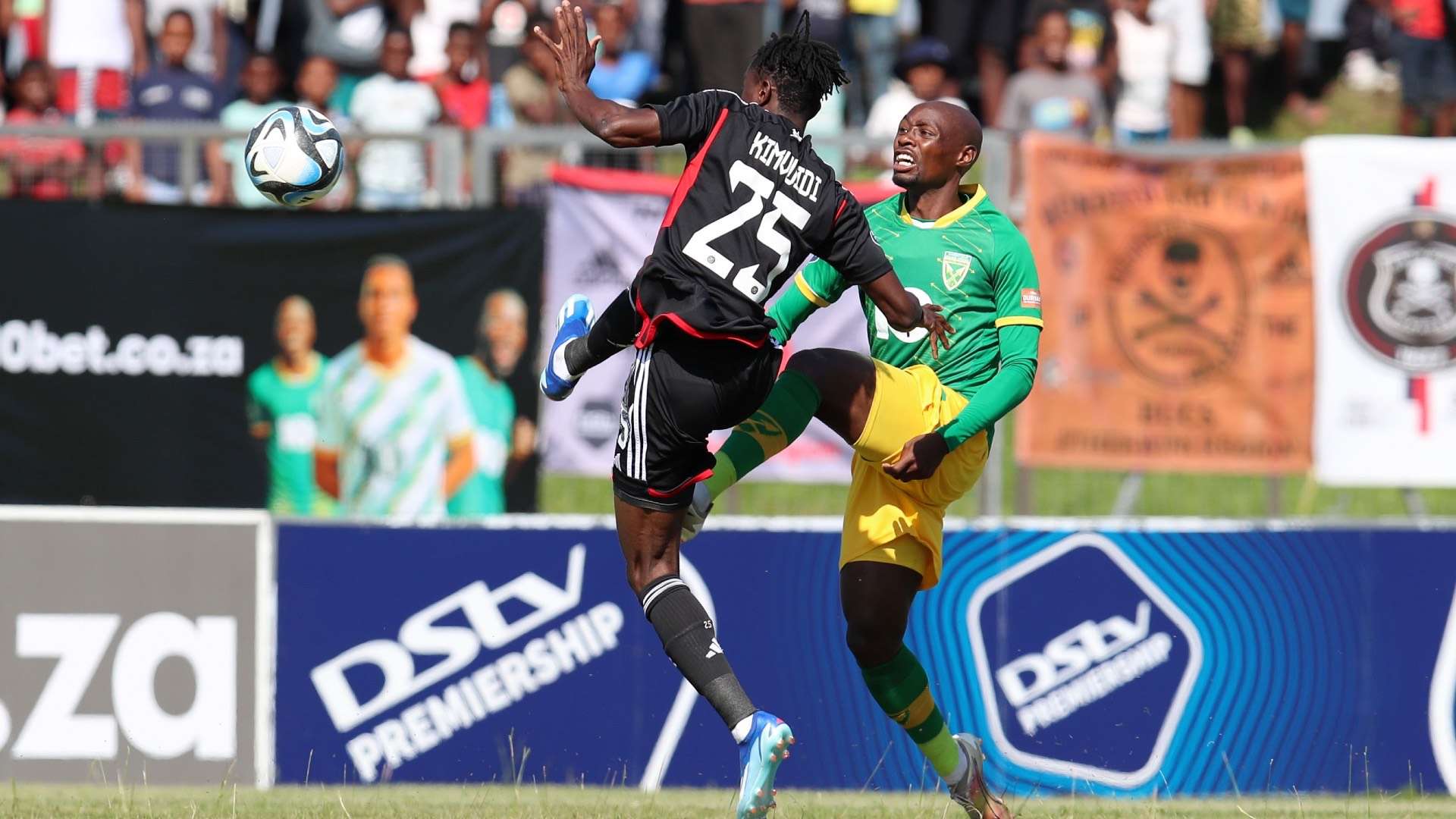 Themba Mantshiyane of Golden Arrows and Karim Kimvuidi