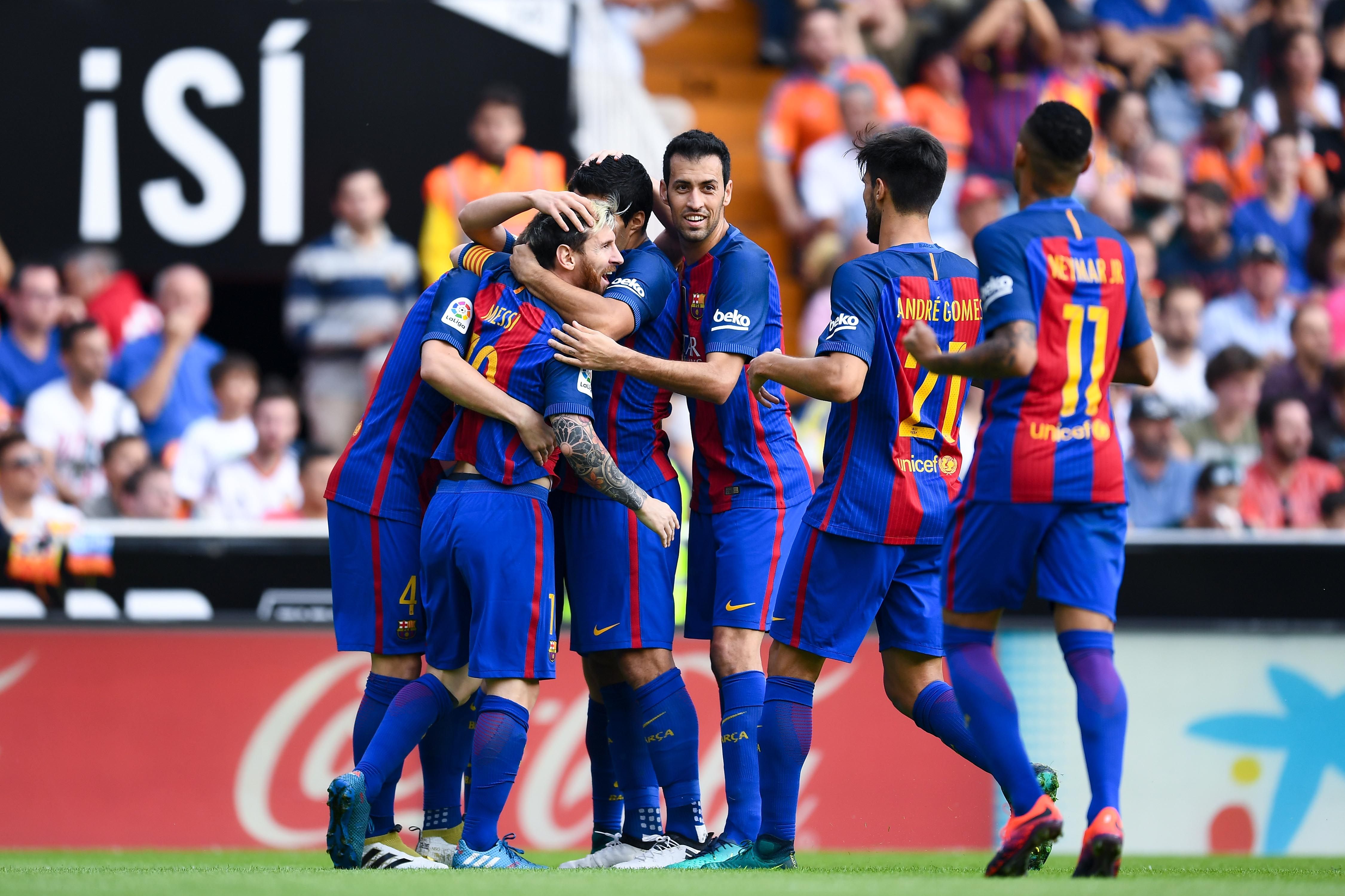 Barcelona players cerebrating with Messi