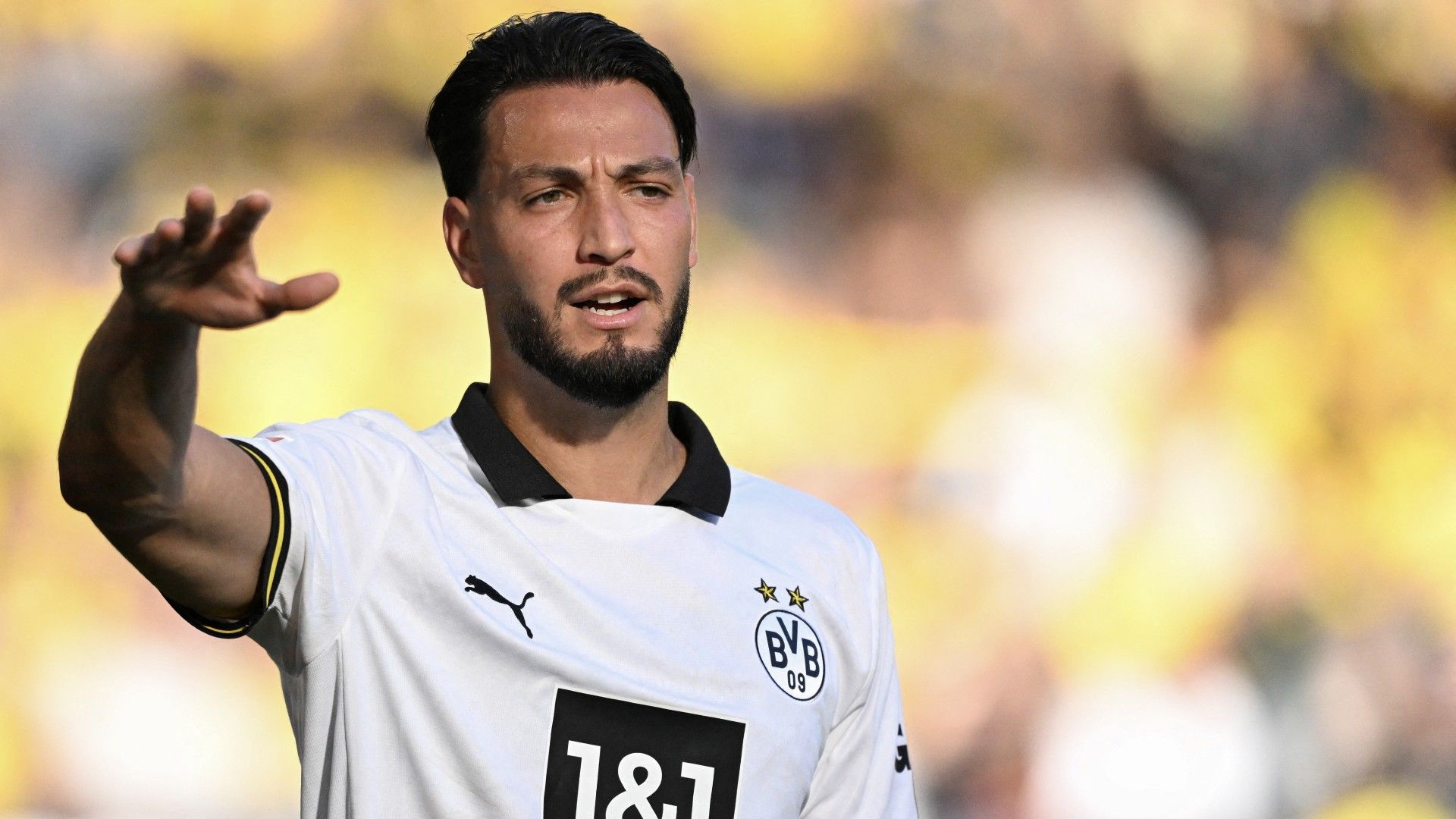 Dortmund's Algerian defender #05 Ramy Bensebaini reacts 