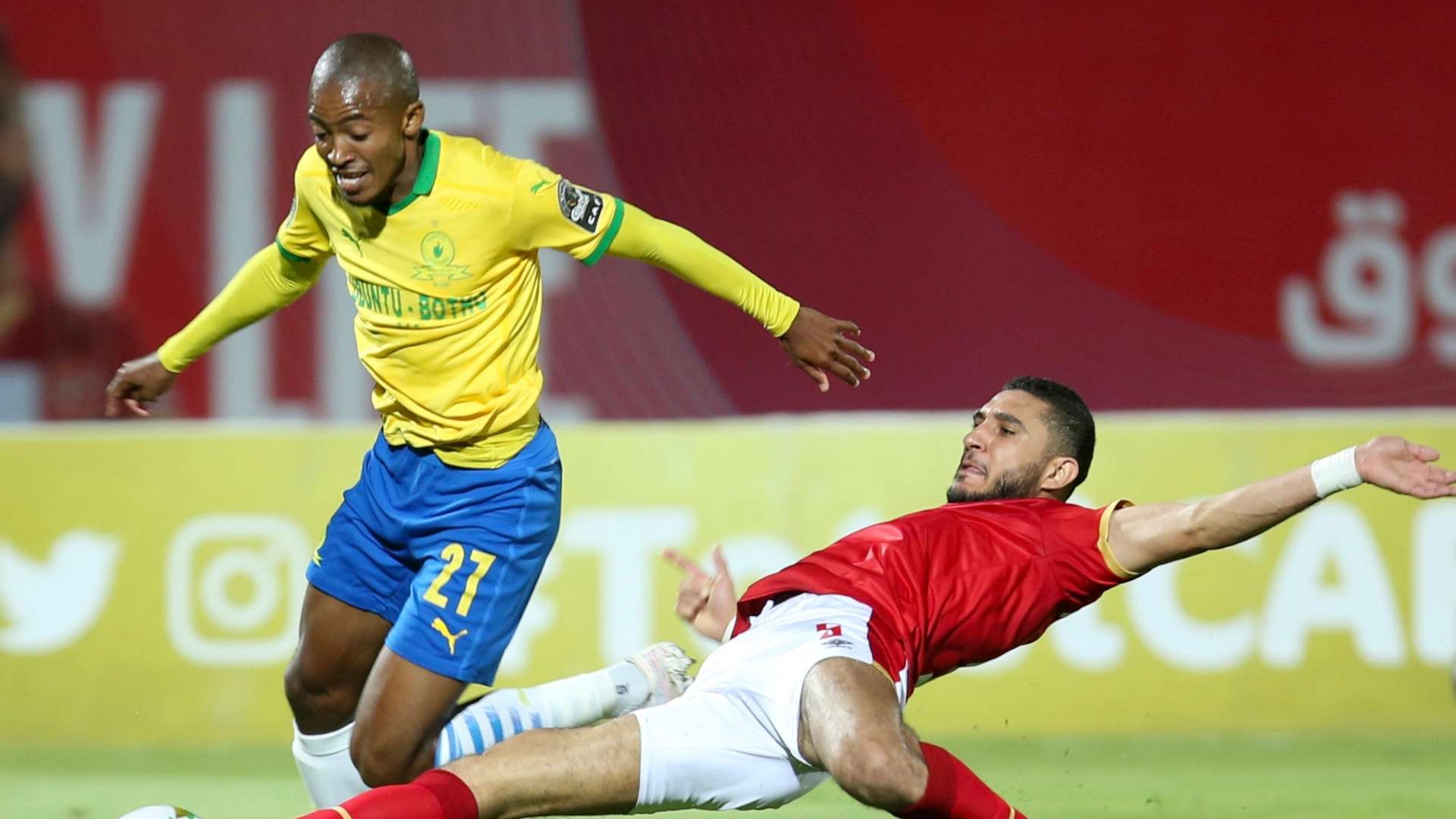Thapelo Morena of Mamelodi Sundowns challenged by Rami Rabia of Al Ahly