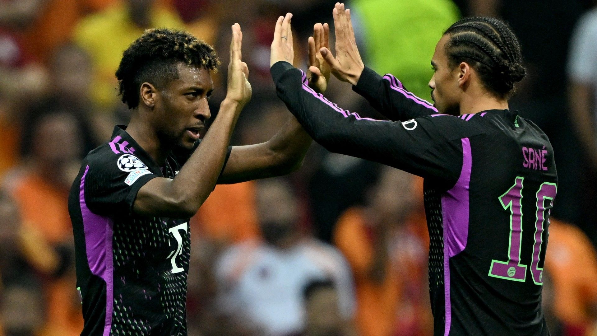 Bayern Munich's French forward #11 Kingsley Coman (L)  midfielder #10 Leroy Sane