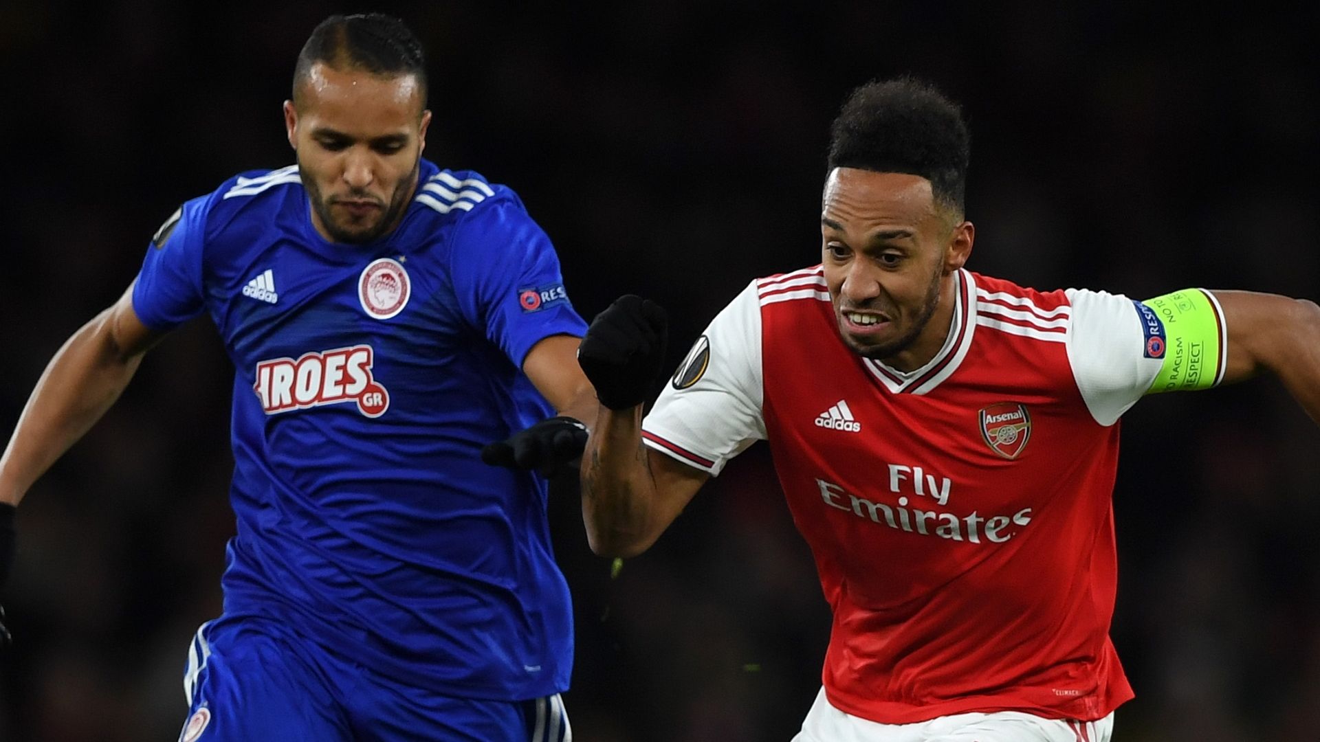 Pierre-Emerick Aubameyang of Arsenal challenged by Youssef El Arabi of Olympiakos