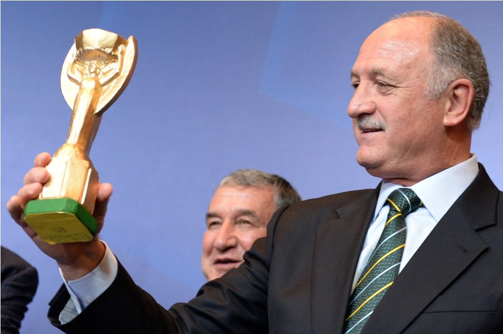 Brazil coach Luiz Felipe Scolari holds a replica of the FIFA World Cup Jules Rimet trophy