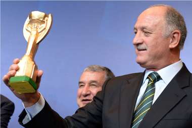 Brazil coach Luiz Felipe Scolari holds a replica of the FIFA World Cup Jules Rimet trophy