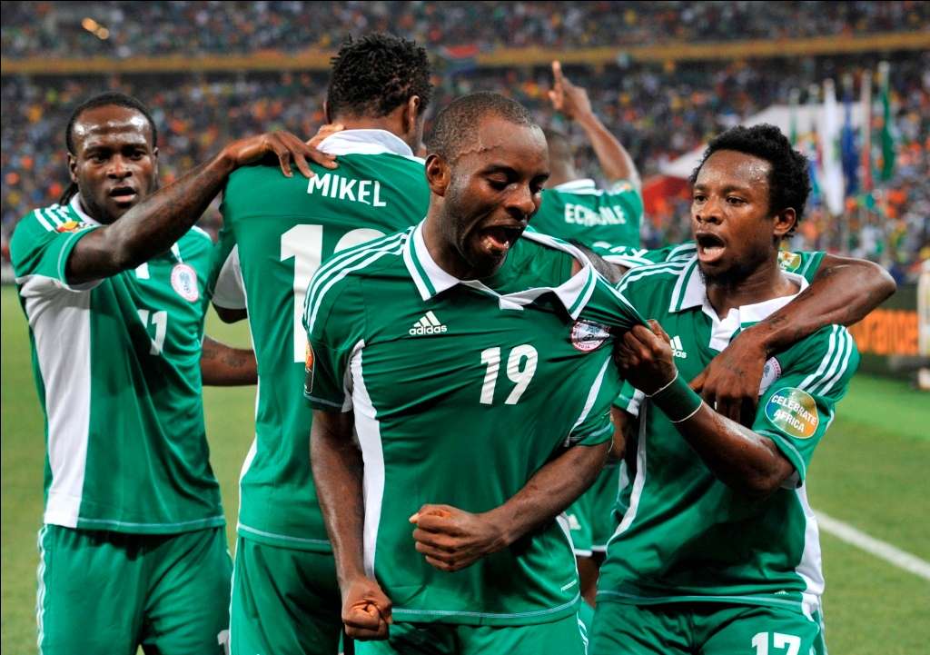 Sunday Mba celebrates opening goal with teammates - 2013 Afcon