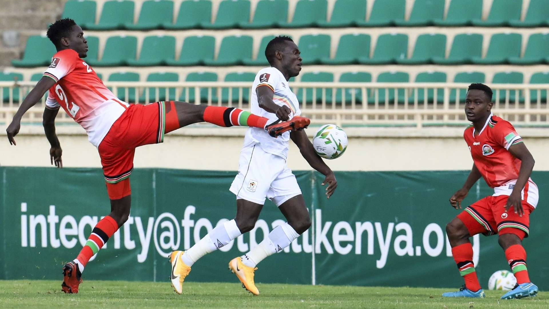 Kenya’s Joseph Okumu (2-L) in action and Erick Ouma vs Uganda.