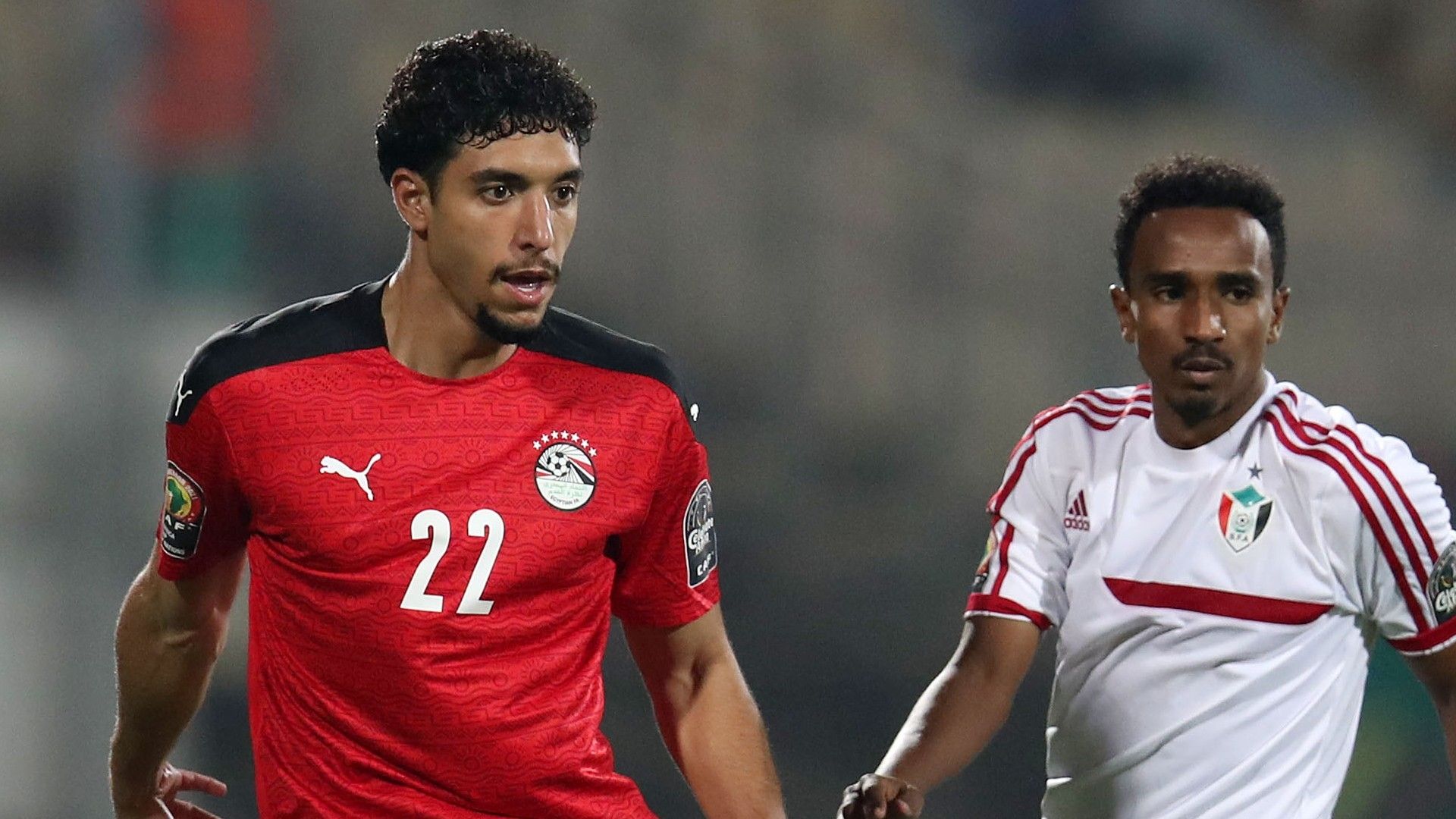 Mustafa Saeed of Sudan challenges Omar Marmoush of Egypt.