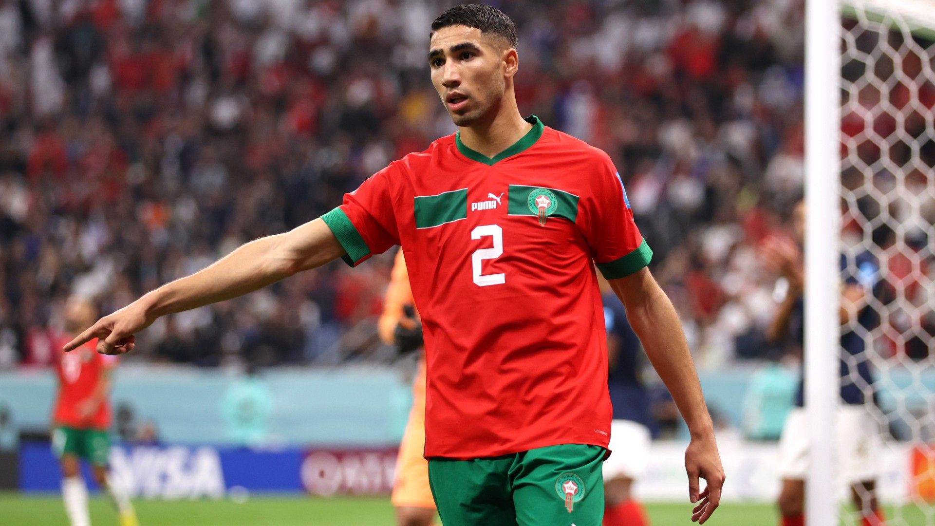 Achraf Hakimi of Morocco reacts
