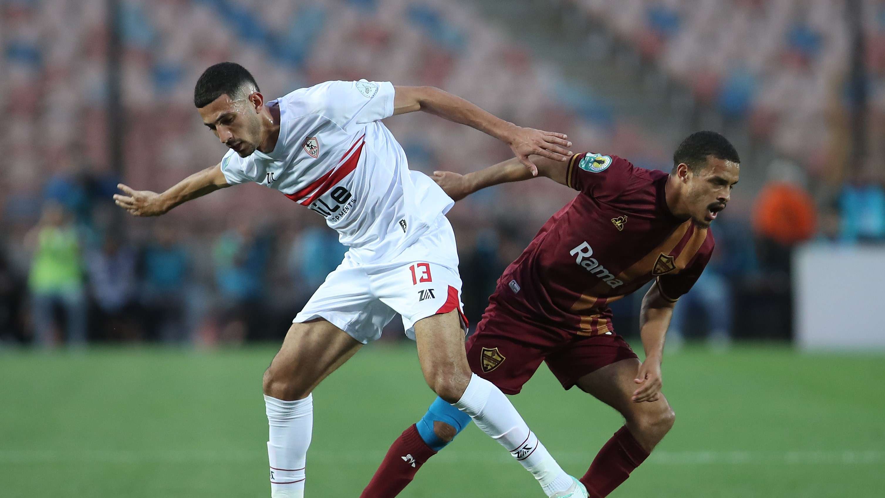 Hossam Abdesalam of Zamalek challenges Devine Titus of Stellenbosch