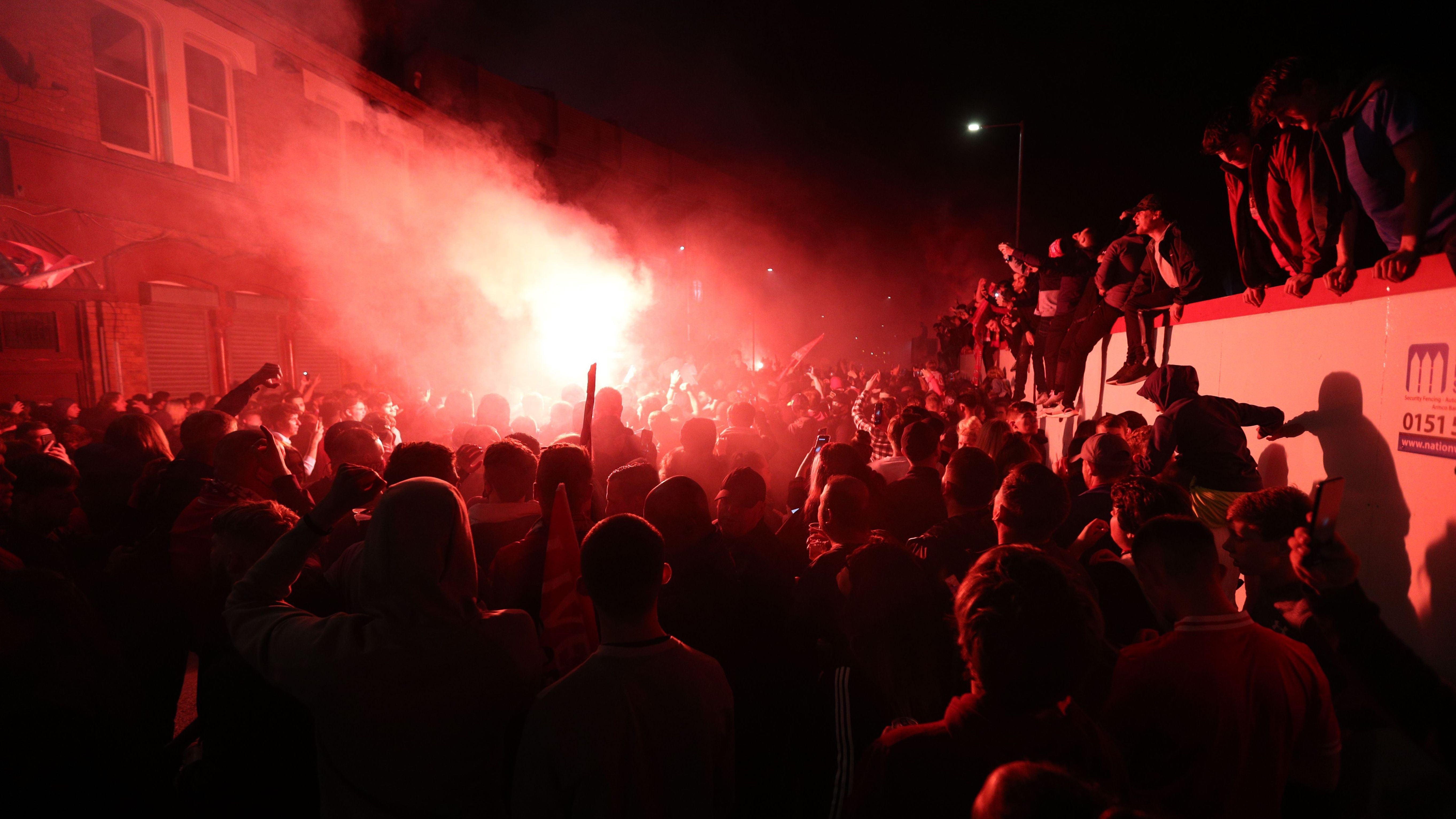Liverpool lifts The Premier League trophy following the Premier League match between Liverpool FC and Chelsea FC at Anfield on July 22, 2020