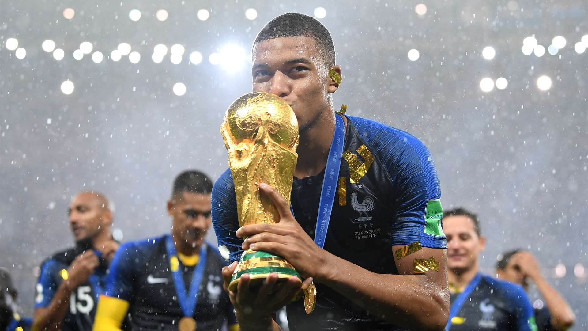 Kylian Mbappe 2018 World Cup trophy kiss