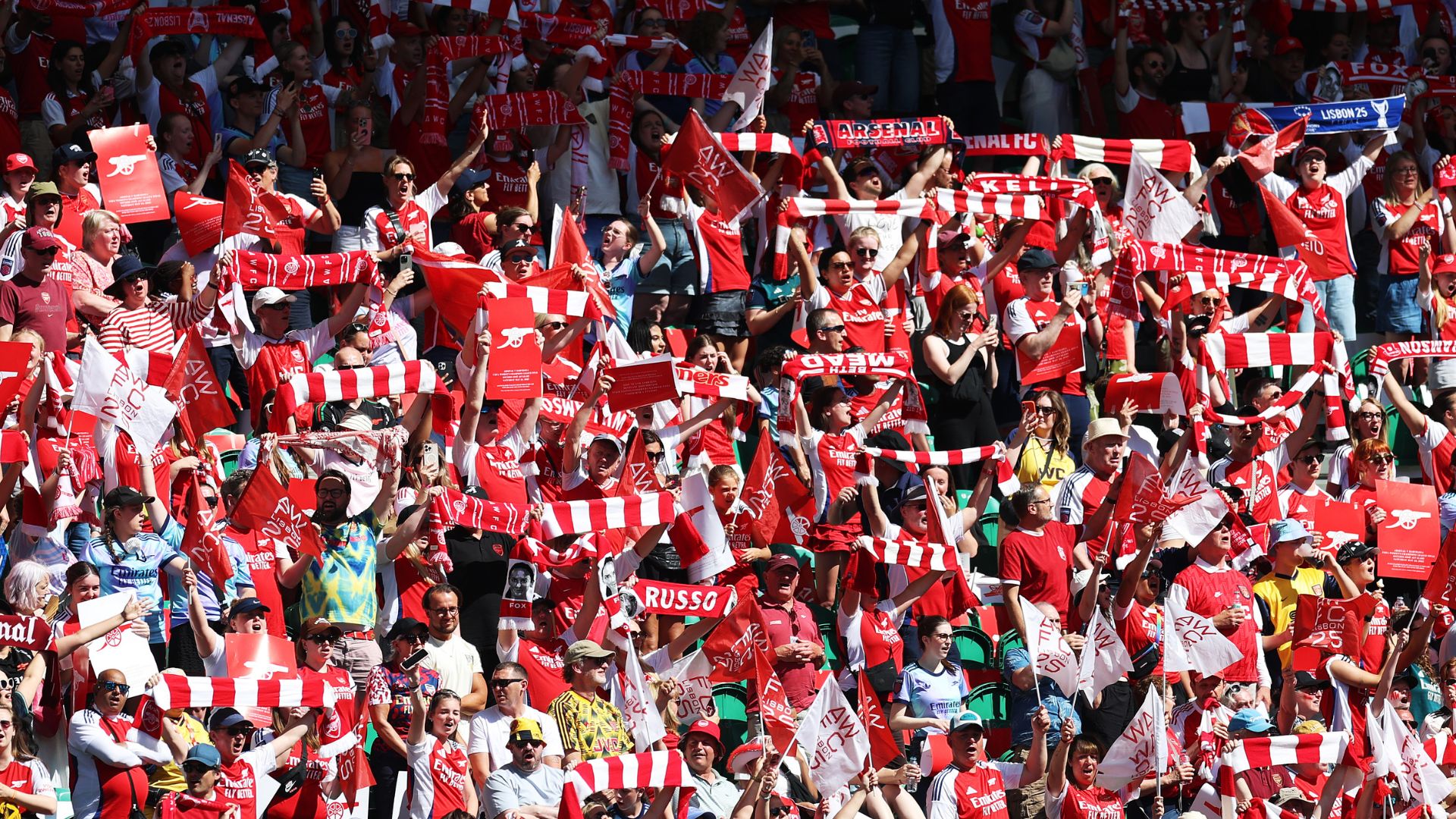 Fans of Arsenal wave scarves Barcelona vs Arsenal