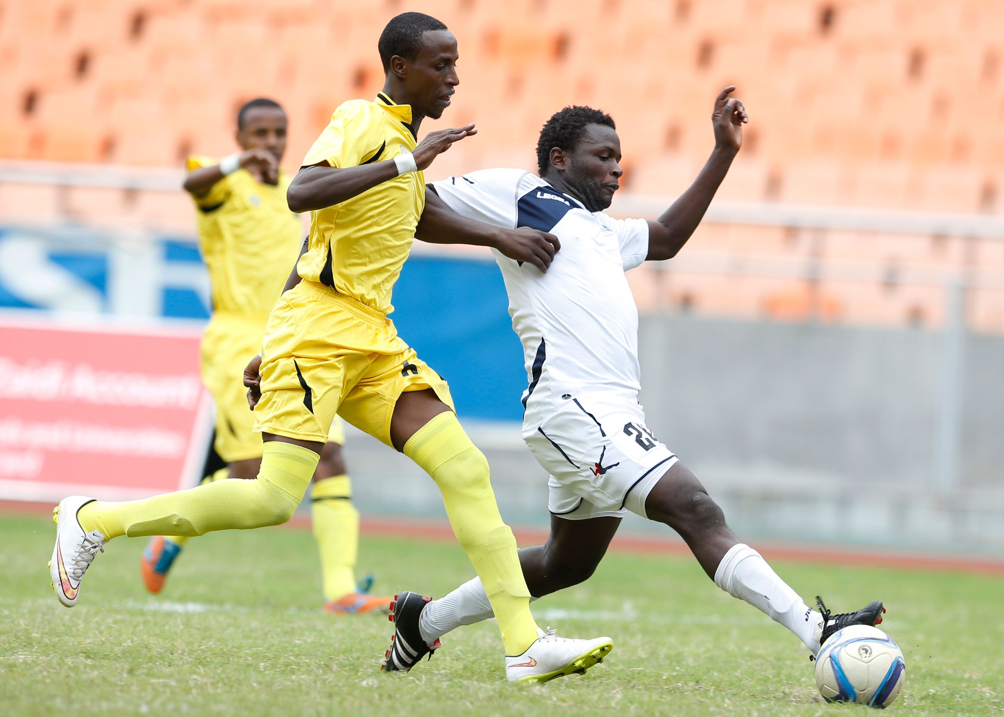 Mohamed Kader (L) of Telecom FC tackle Enock Agwanda of Gor Mahia FC
