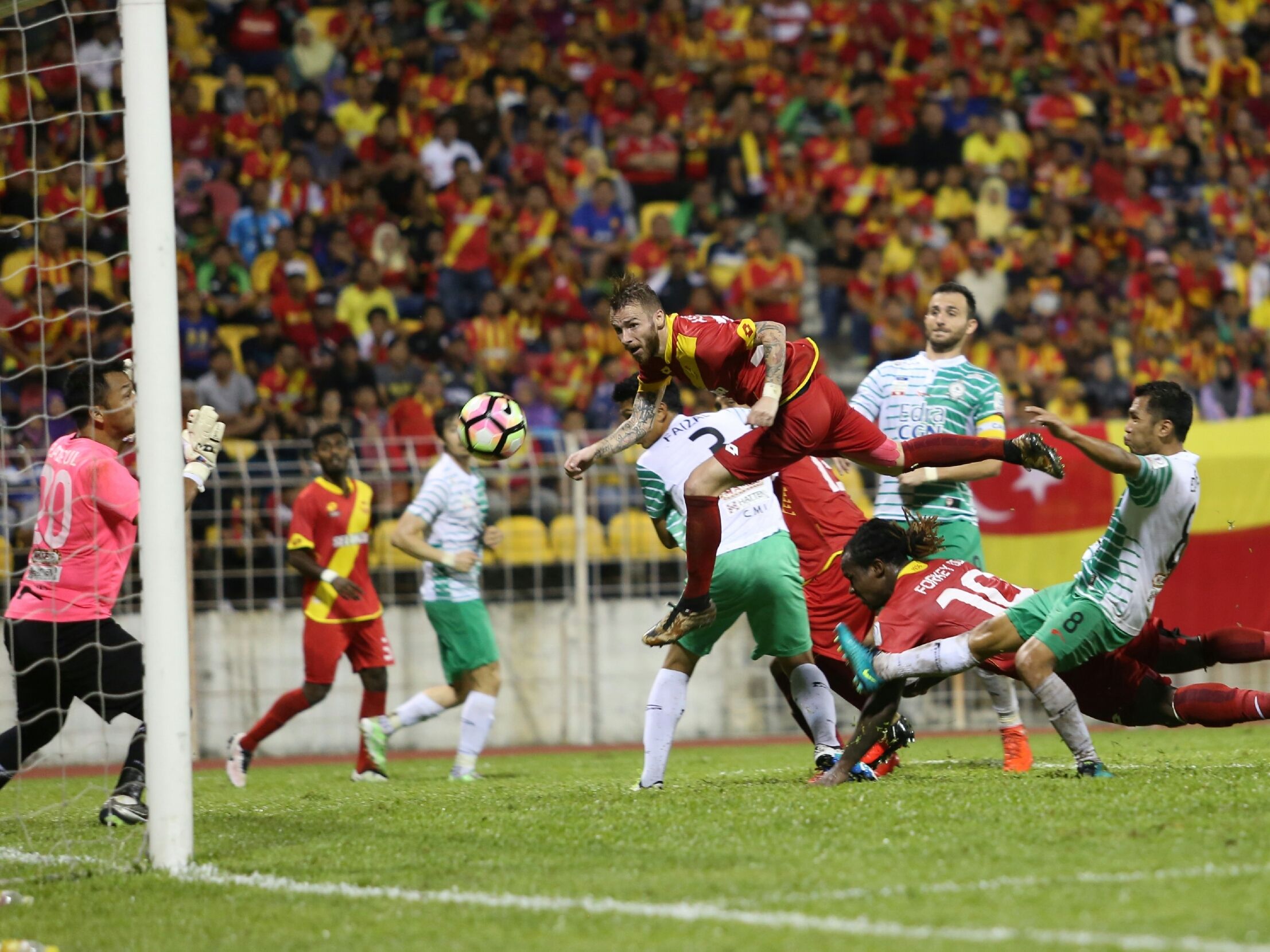 Selangor's Victor Astafei (in the air) heading in his team's equaliser against Melaka United 27/1/2017