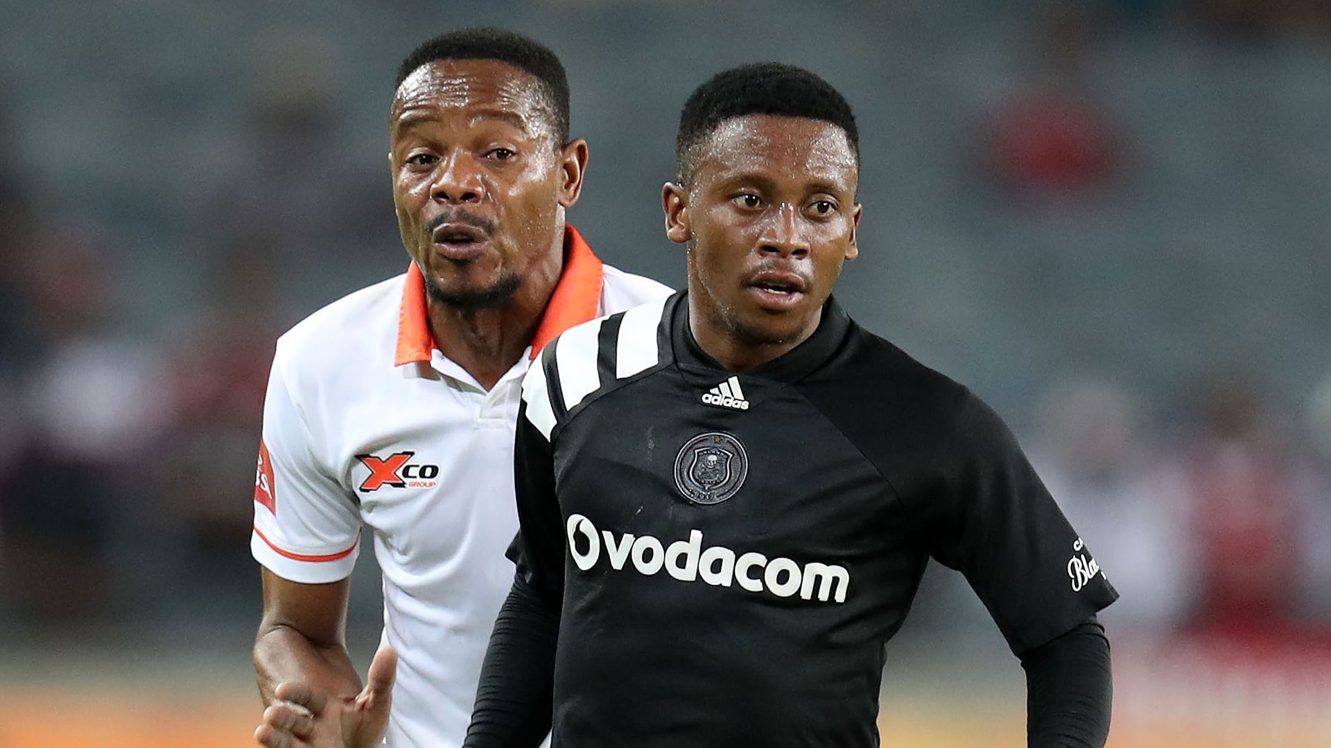 Thabiso Kutumela of Orlando Pirates challenged by Polokwan City's Thabiso Semenya