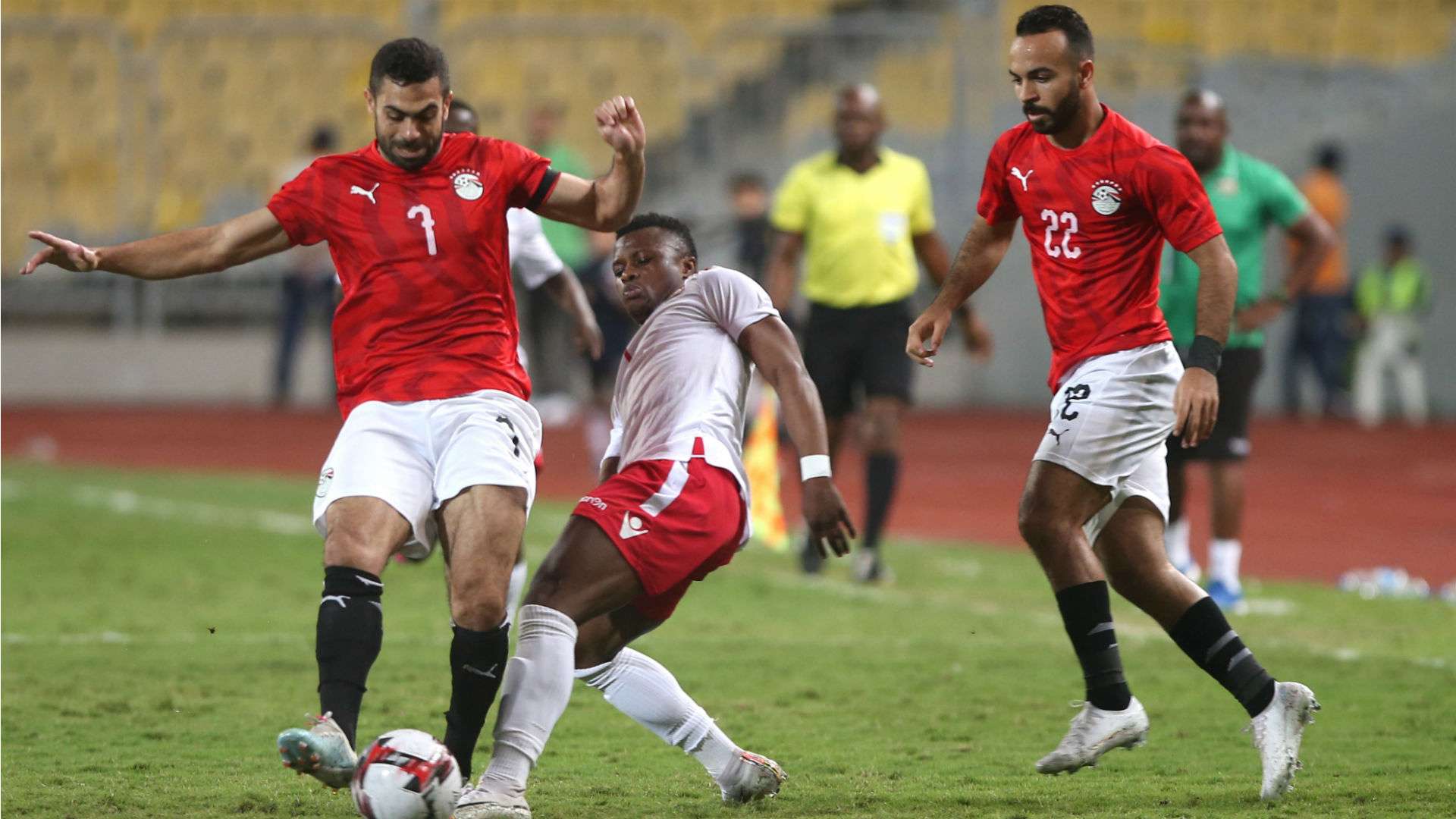Egypt's Ahmed Fathi (L) in action against Kenya and Harambee Stars player Ayub Timbe.