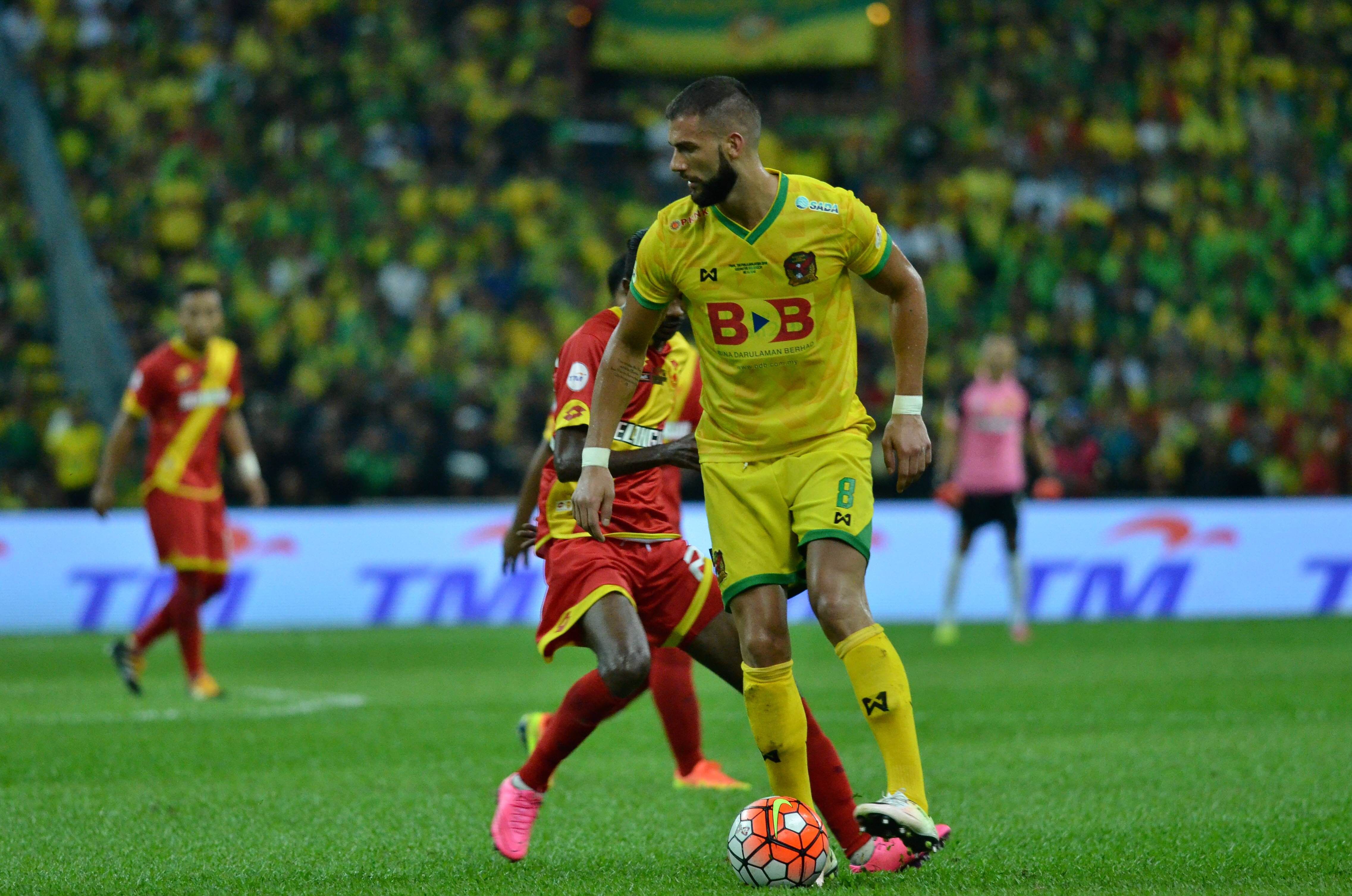 Kedah's Liridon Krasniqi shielding the ball from a Selangor player during the Malaysia Cup final 30/10/16