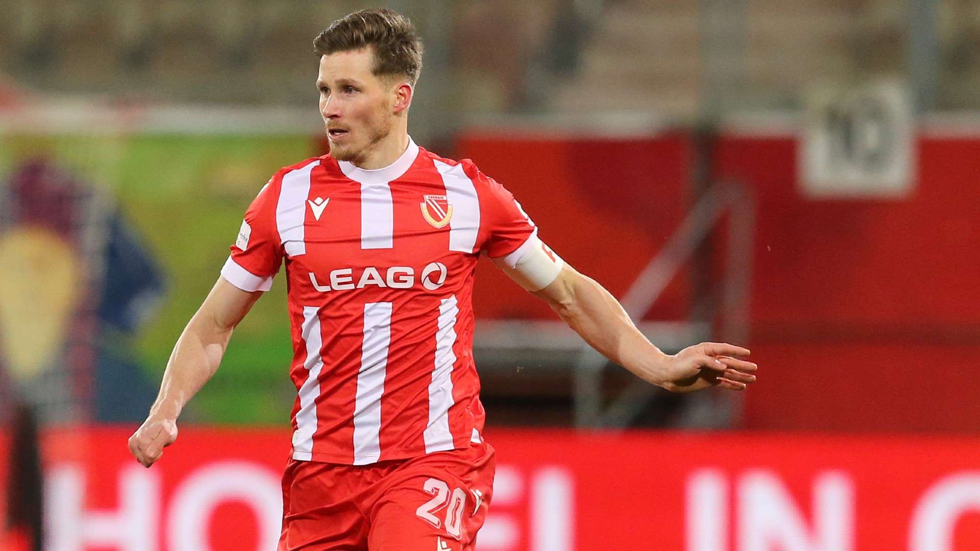 Axel Borgmann of Cottbus runs with the ball