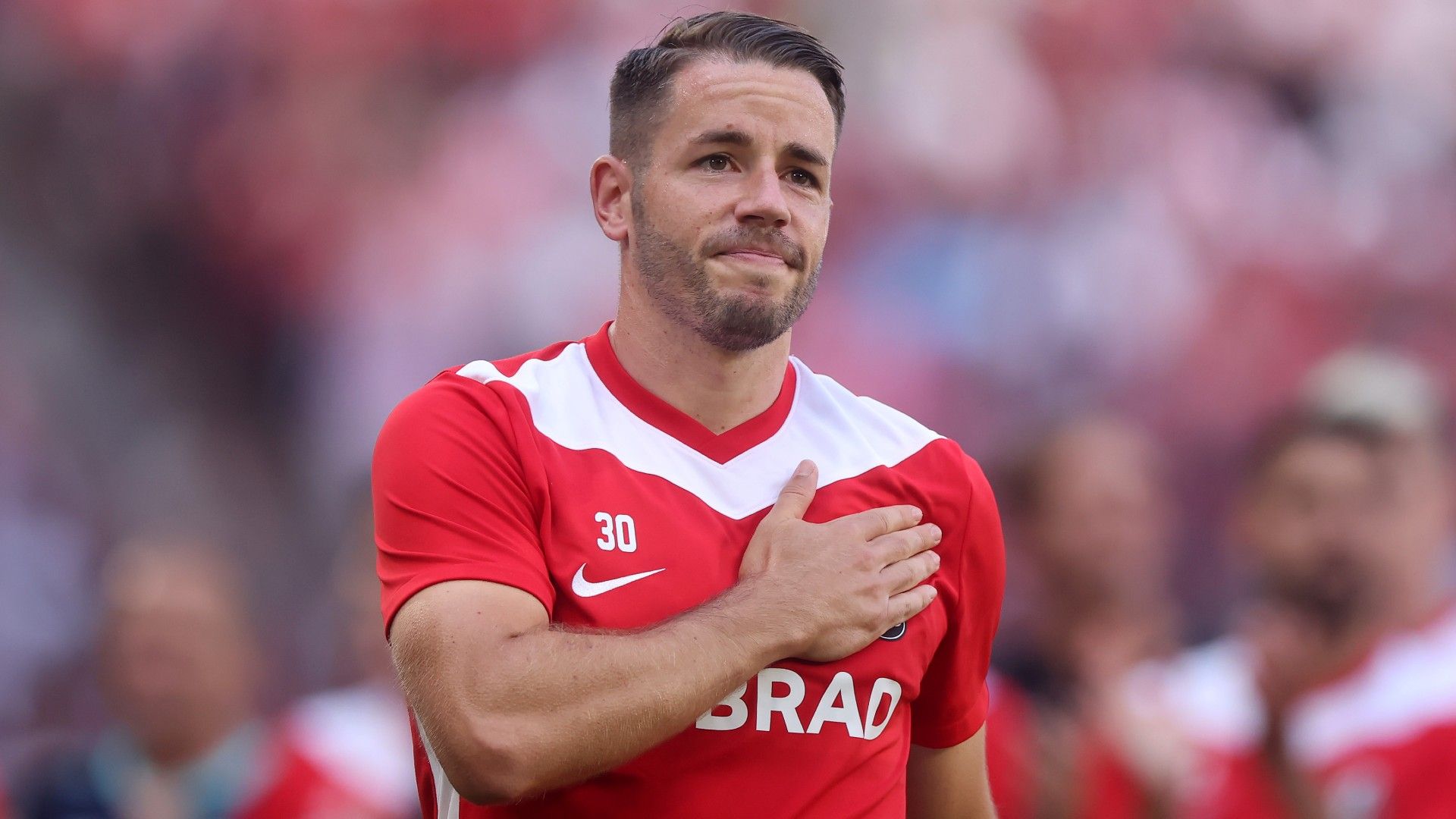 Christian Guenter of Sport-Club Freiburg wave to the fans