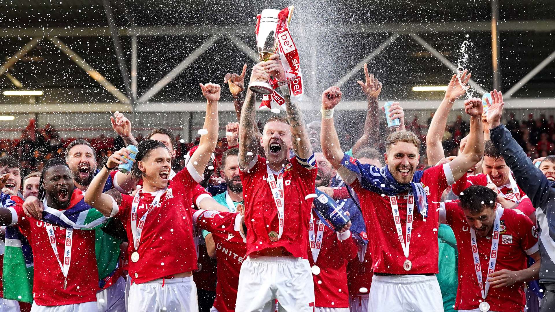 James McClean of Wrexham lifts the trophy - Getty Images