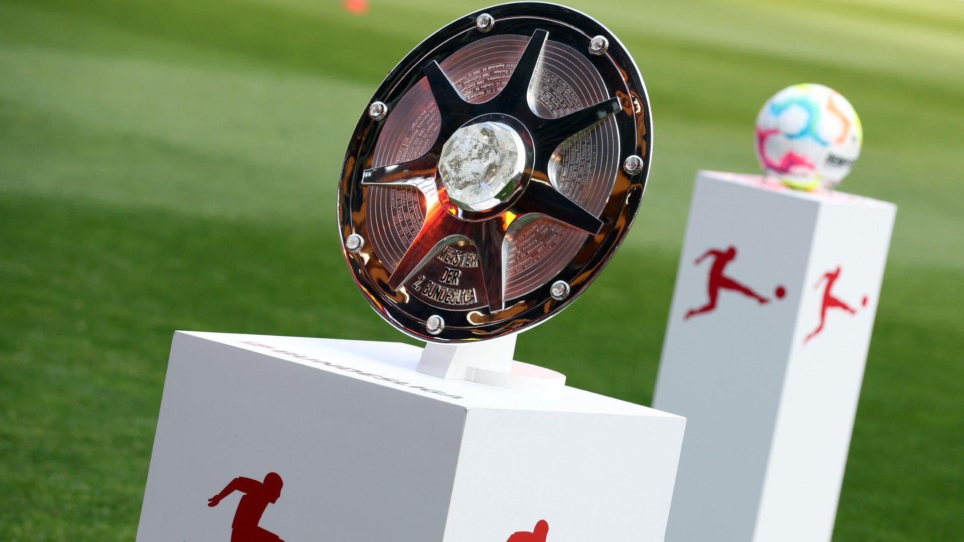 A detailed view of the Championship trophy and the Select Derbystar matchball