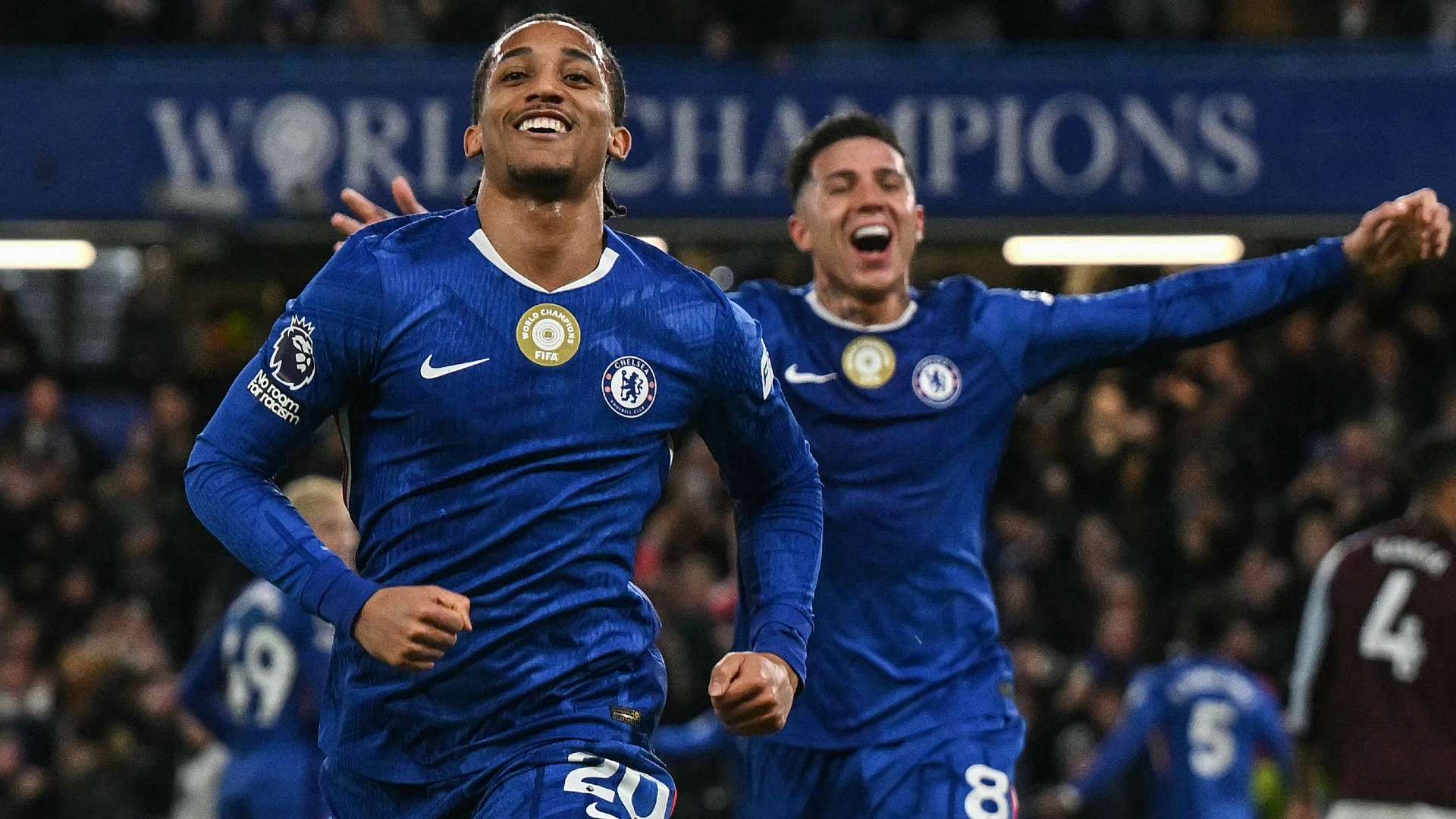 Chelsea's Brazilian striker #20 Joao Pedro (L) celebrates scoring the team's first goal with Chelsea's Argentinian midfielder #08 Enzo Fernandez