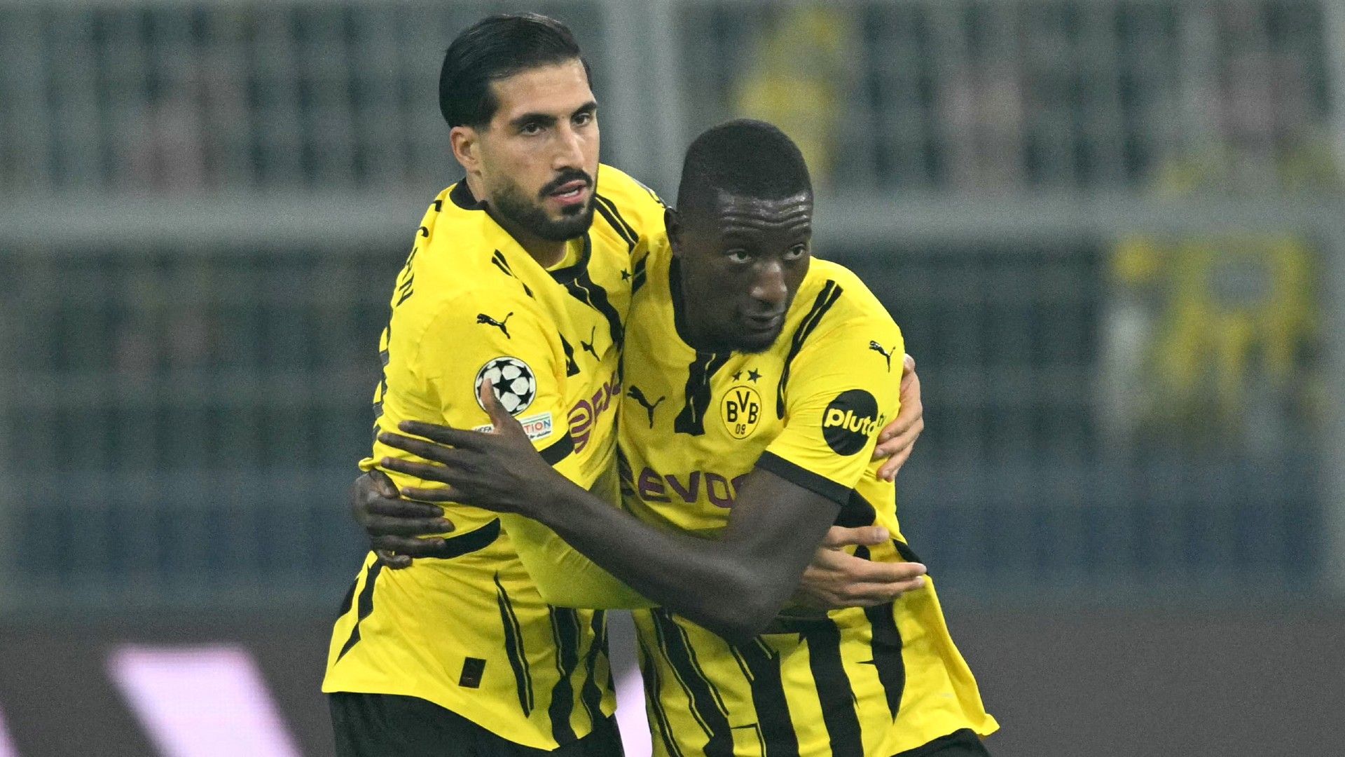  Dortmund's Guinean forward #09 Serhou Guirassy celebrates scoring with Dortmund's German midfielder #23 Emre Can 