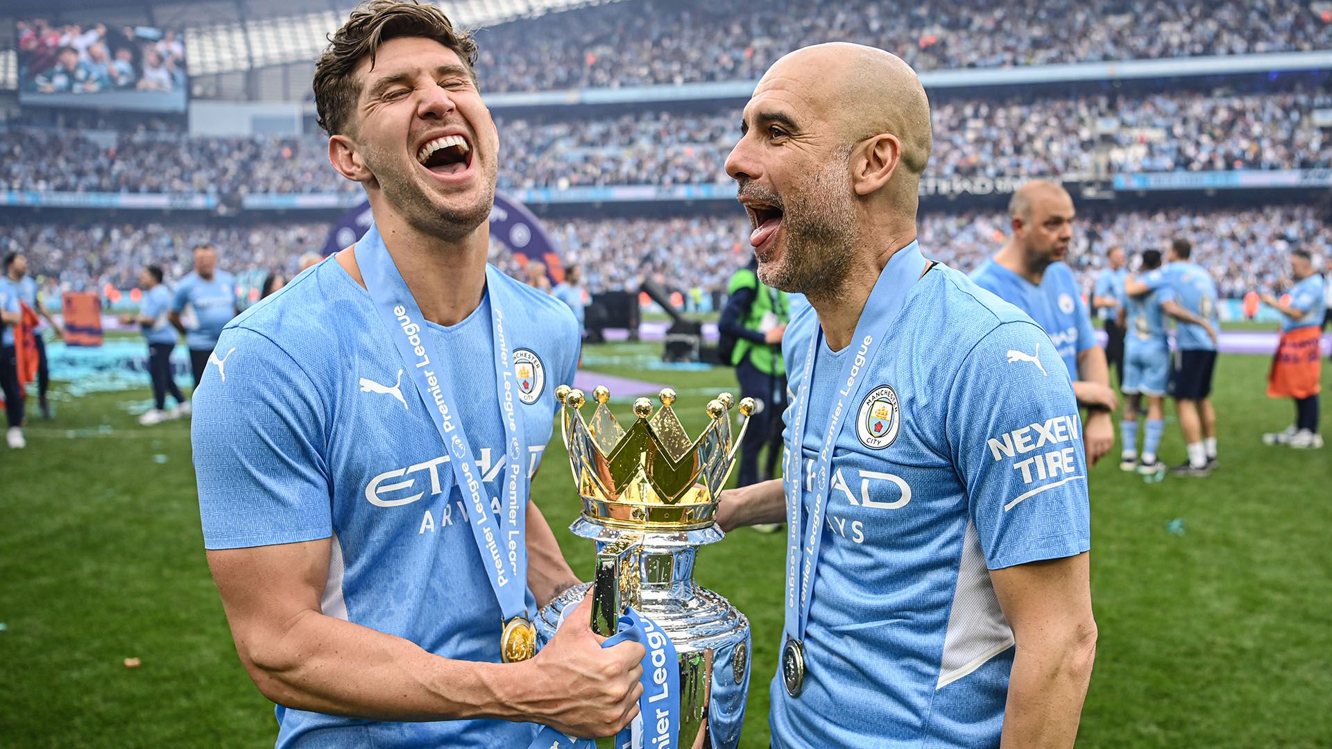 Stones Guardiola Manchester City Premier League trophy